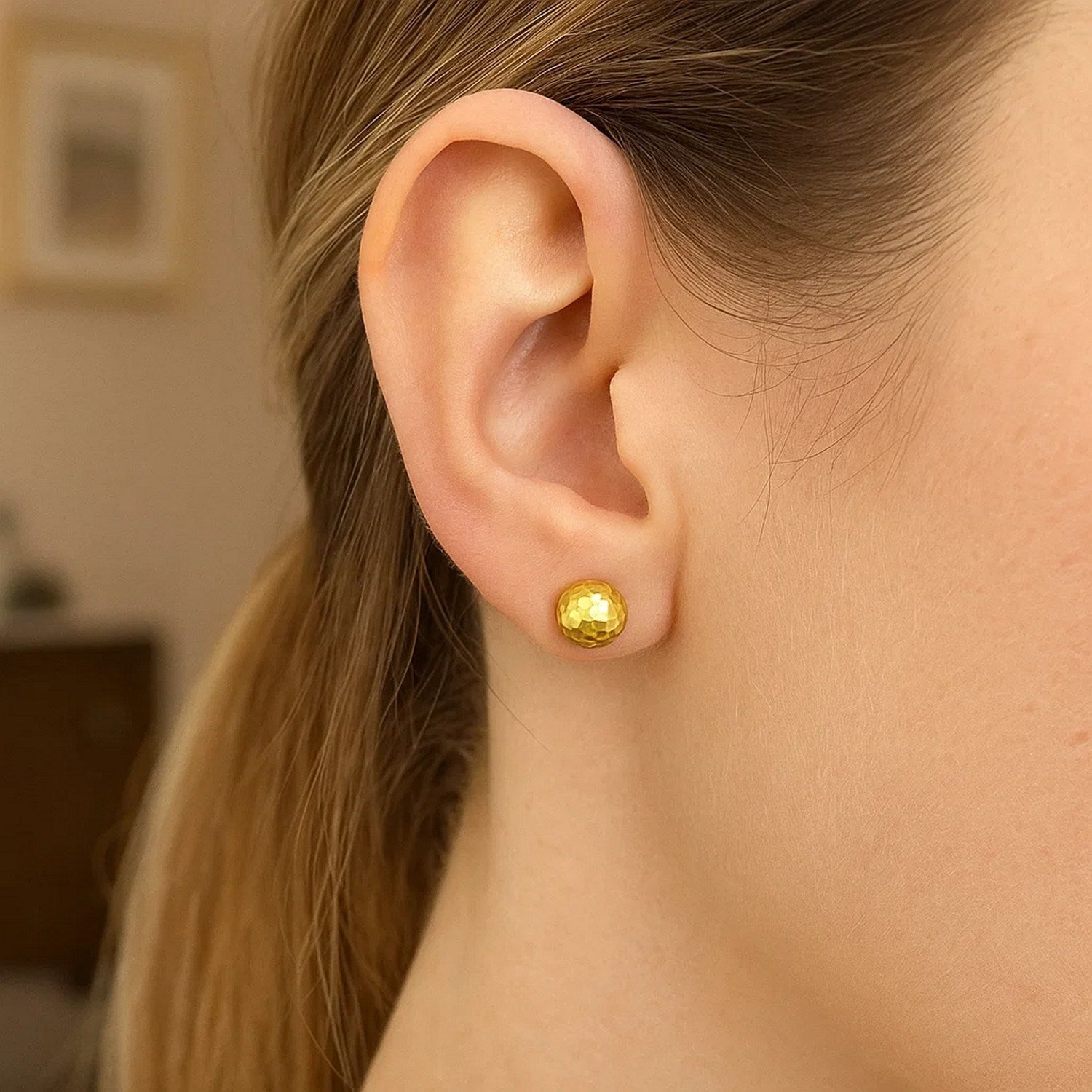 14k yellow gold faceted stud earrings showcasing a modern design with elegant simplicity and refined craftsmanship.