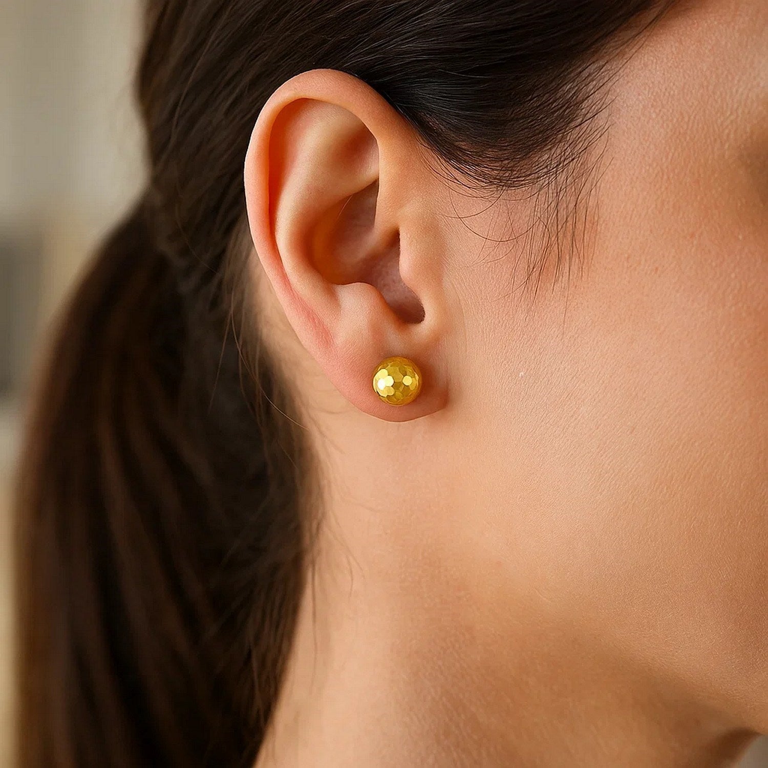 14k yellow gold faceted stud earrings featuring a sleek modern design for elegant everyday wear.