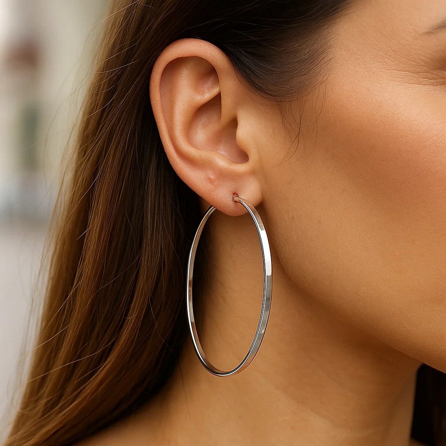 Sterling silver polished large rectangular hoop earrings with a modern design, perfect for elegant occasions.