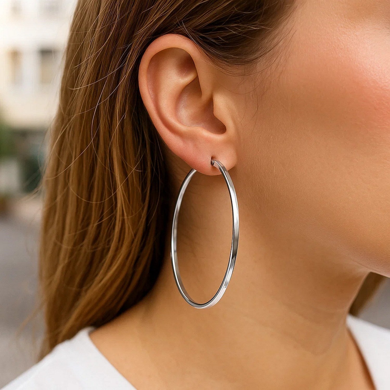 Sterling silver polished large rectangular hoop earrings with a sleek modern design, perfect for elegant occasions.