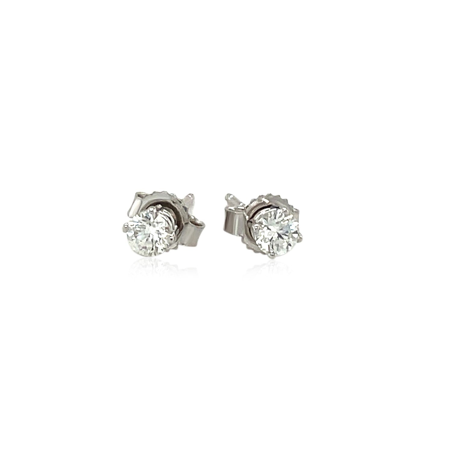 14k white gold diamond stud earrings with modern four prong setting, showcasing round brilliant cut stones.
