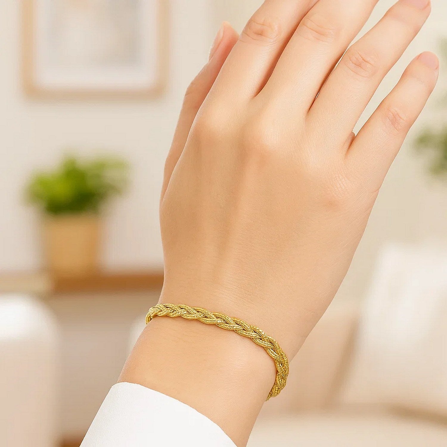 14k yellow gold braided bracelet with modern design, showcasing luxury craftsmanship and elegance.