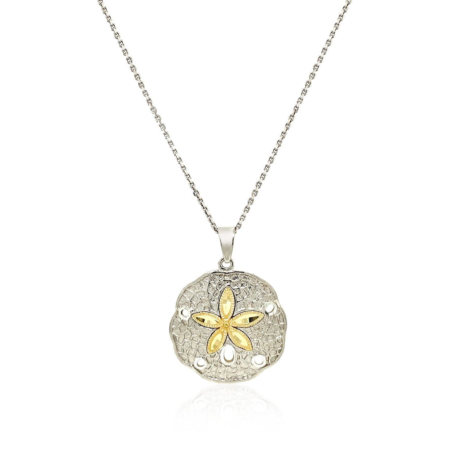 Elegant sterling silver and 14k yellow gold sand dollar pendant with intricate detailing, perfect for a chic necklace.