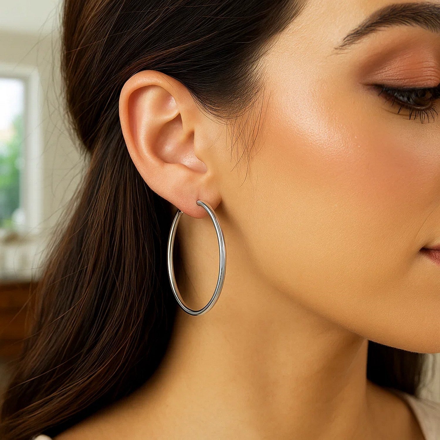 Contemporary 14k white gold polished hoop earrings showcasing a sleek, elegant design for sophisticated style.