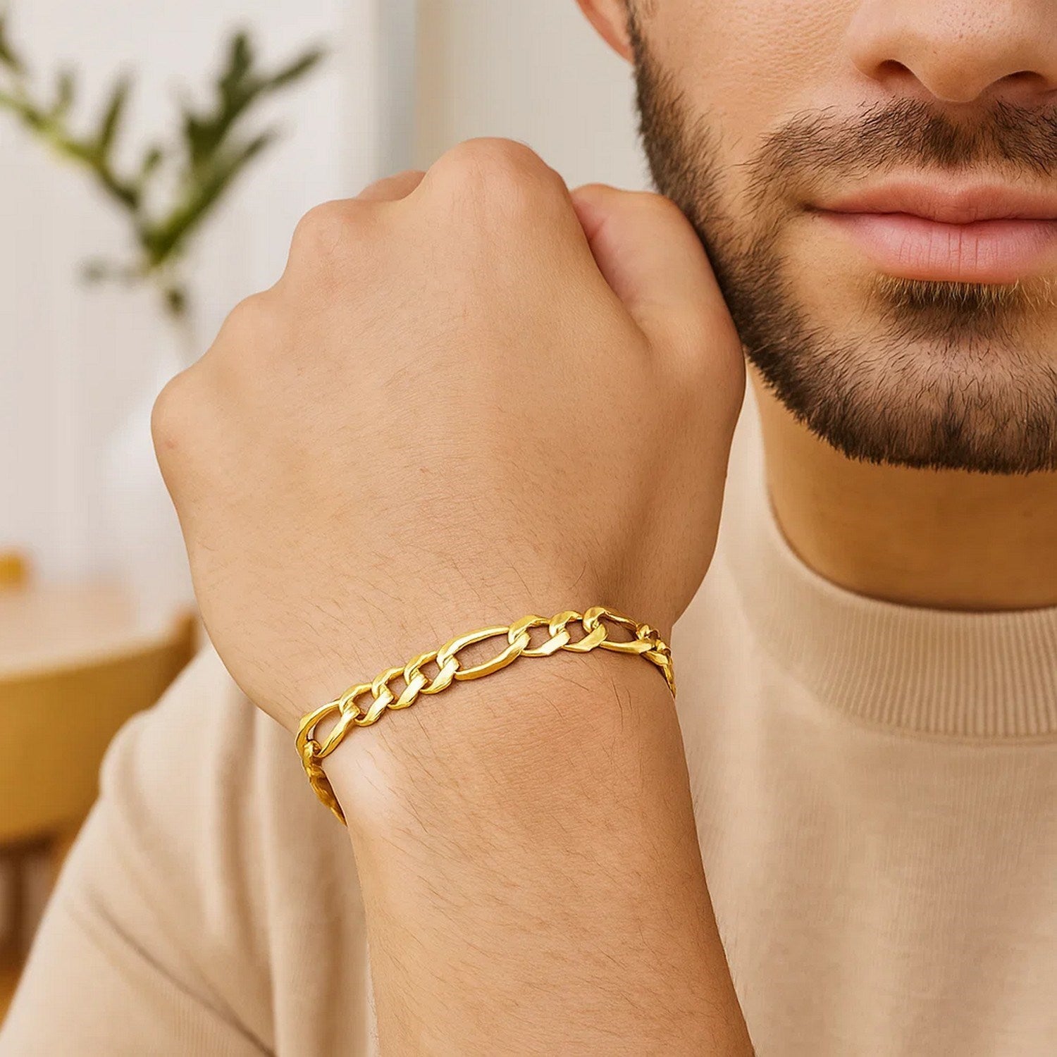 14k yellow gold solid Figaro bracelet featuring modern chain links, perfect for elegant layering or standalone wear.