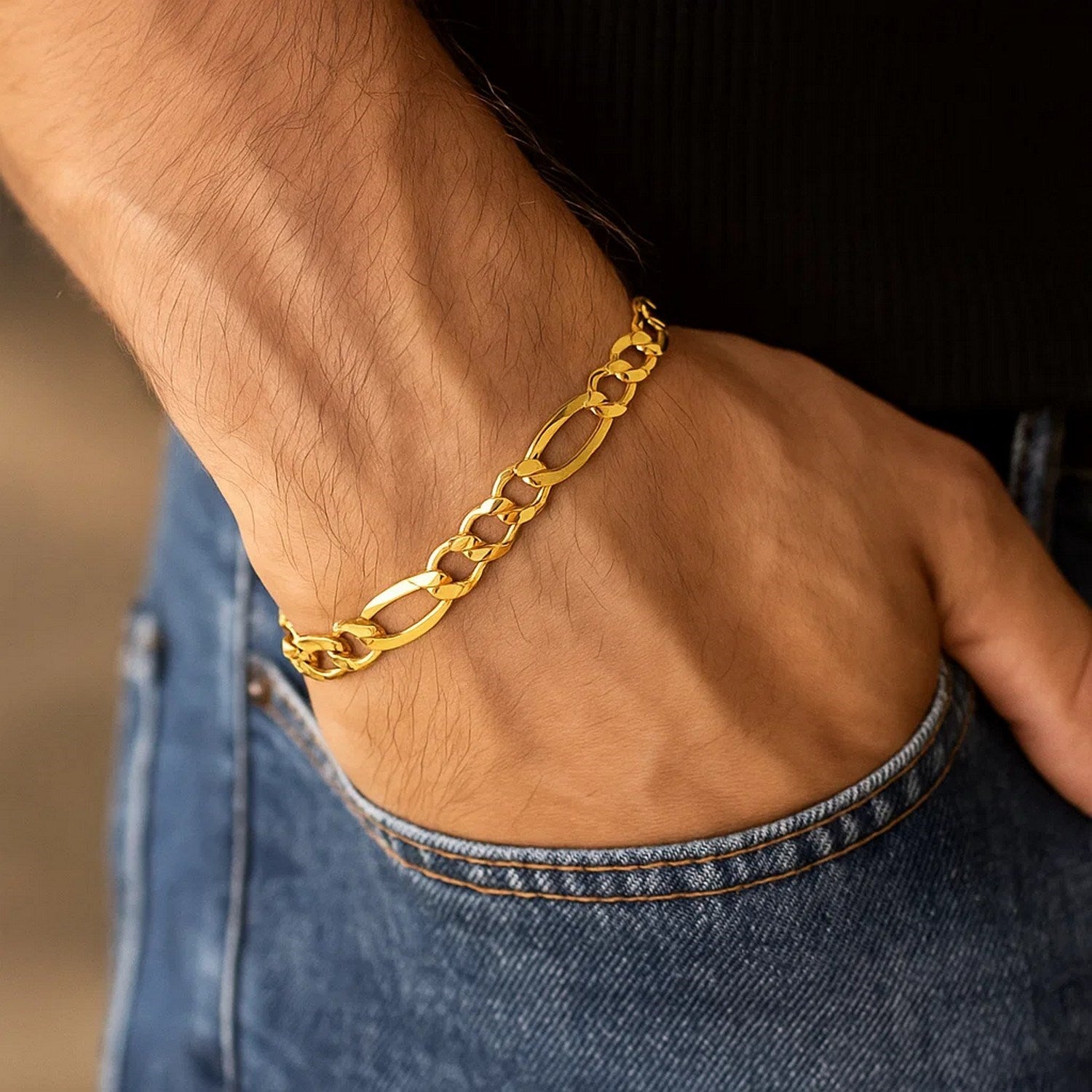 14k yellow gold solid Figaro bracelet featuring modern chain links, elegant and timeless luxury accessory.