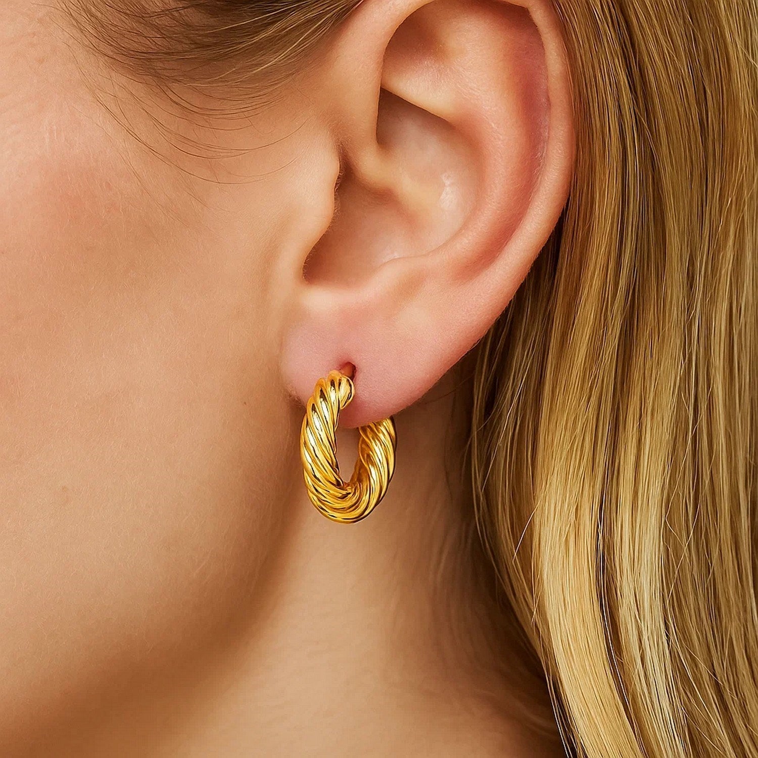 14k yellow gold twisted cable small hoop earrings exuding elegance and timeless sophistication.