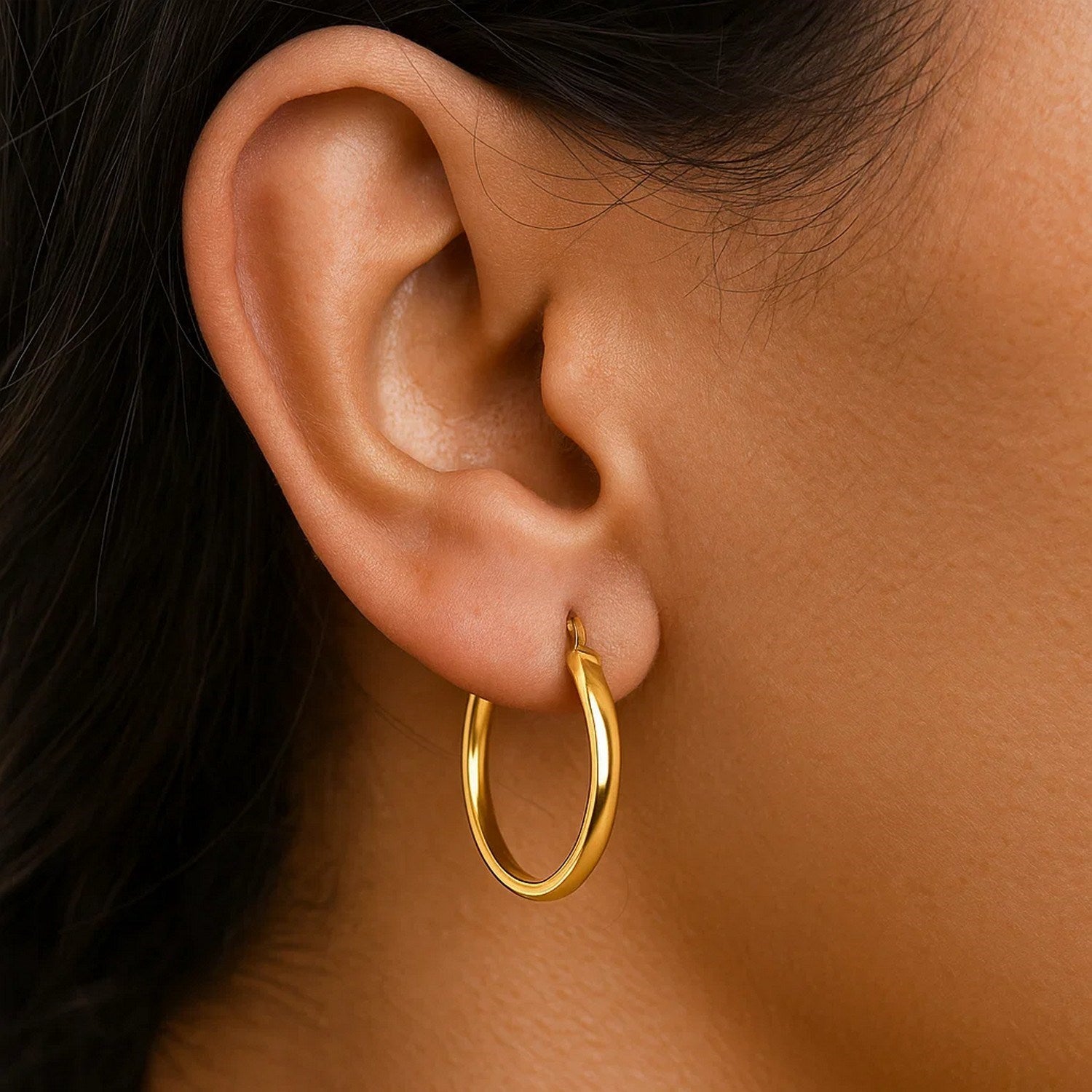 14k yellow gold polished hoop earrings with a sleek modern design, perfect for elegant everyday wear.