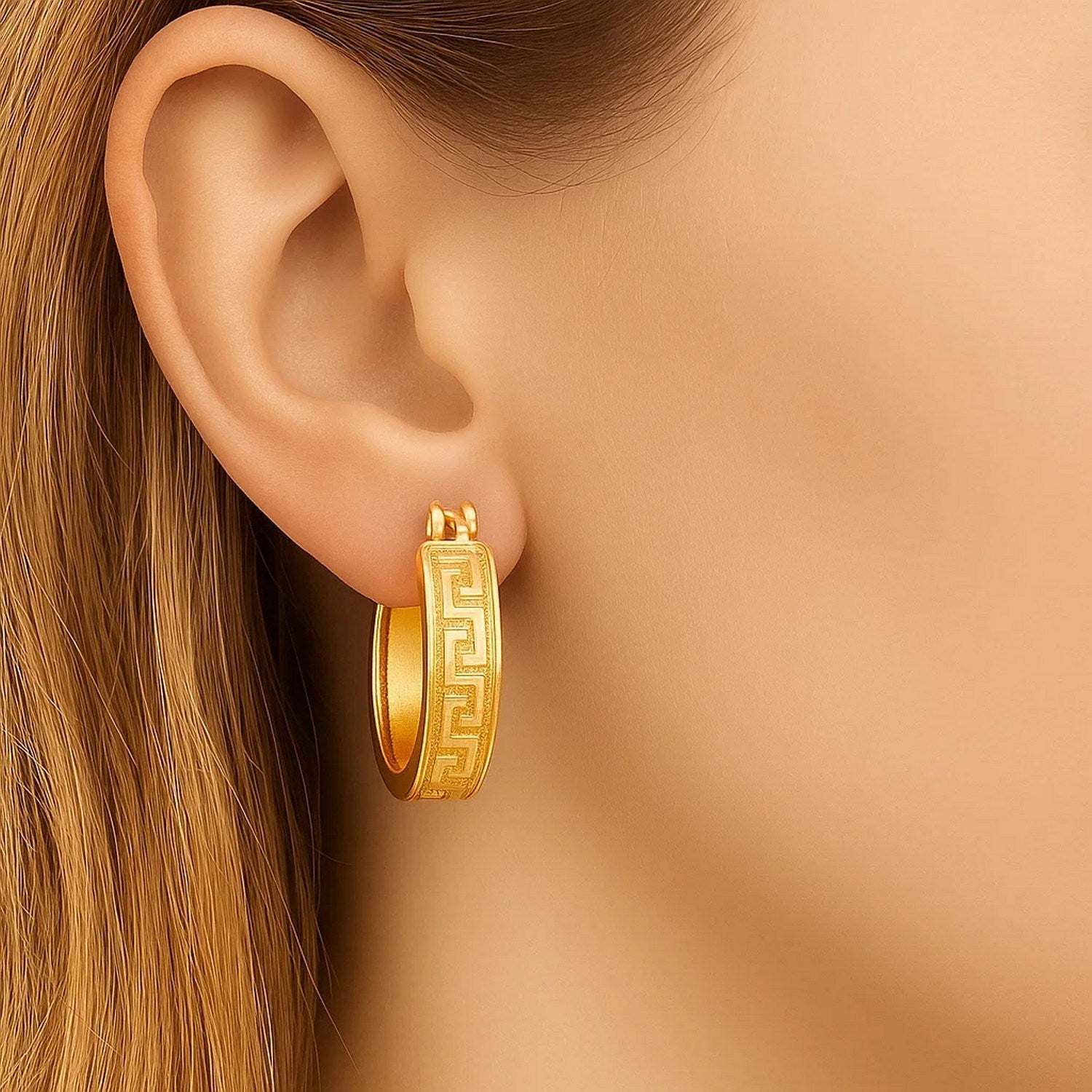 14k yellow gold small hoop earrings featuring a modern Greek key design, perfect for elegant everyday wear.