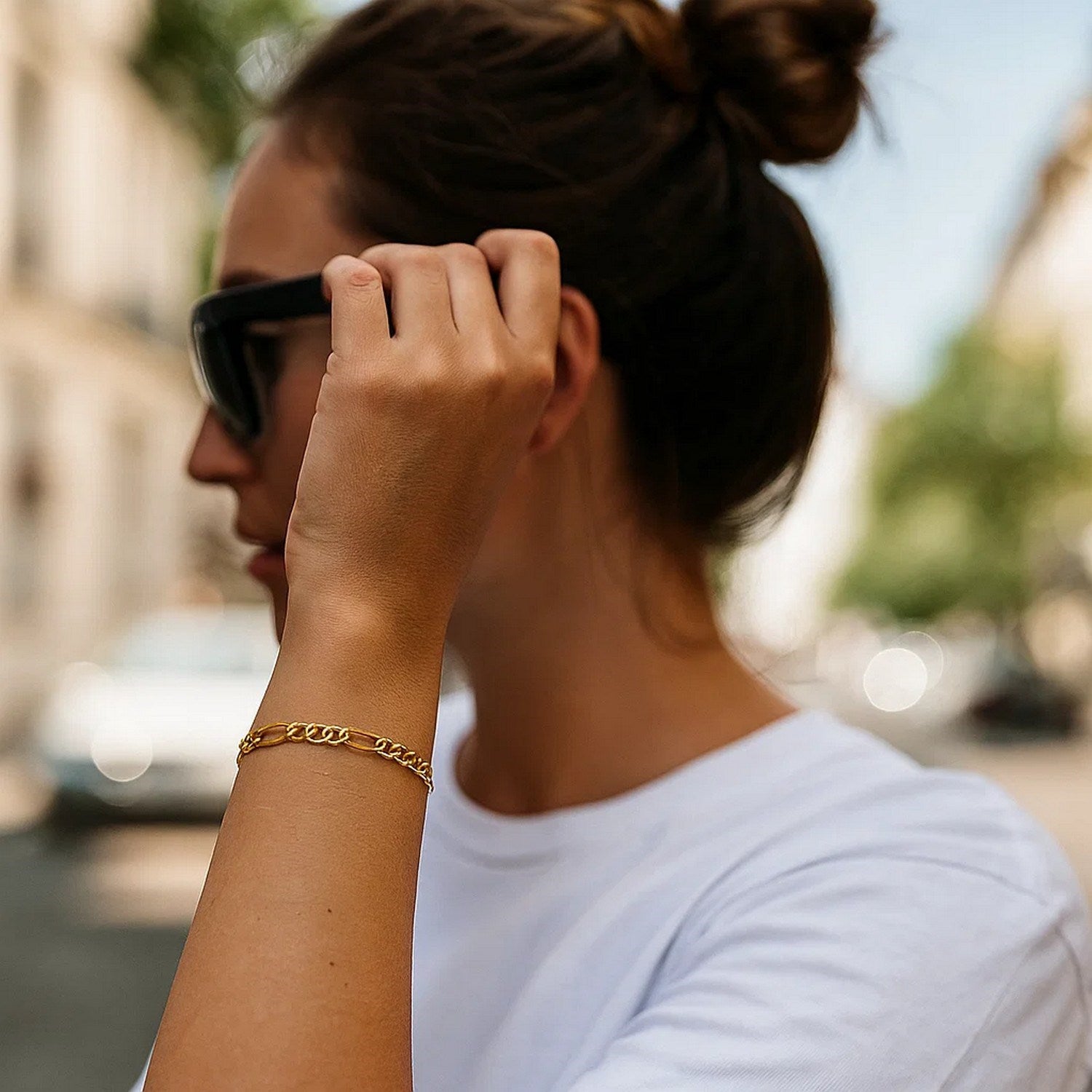 14k yellow gold solid Figaro bracelet featuring modern chain links, elegantly crafted for timeless luxury.