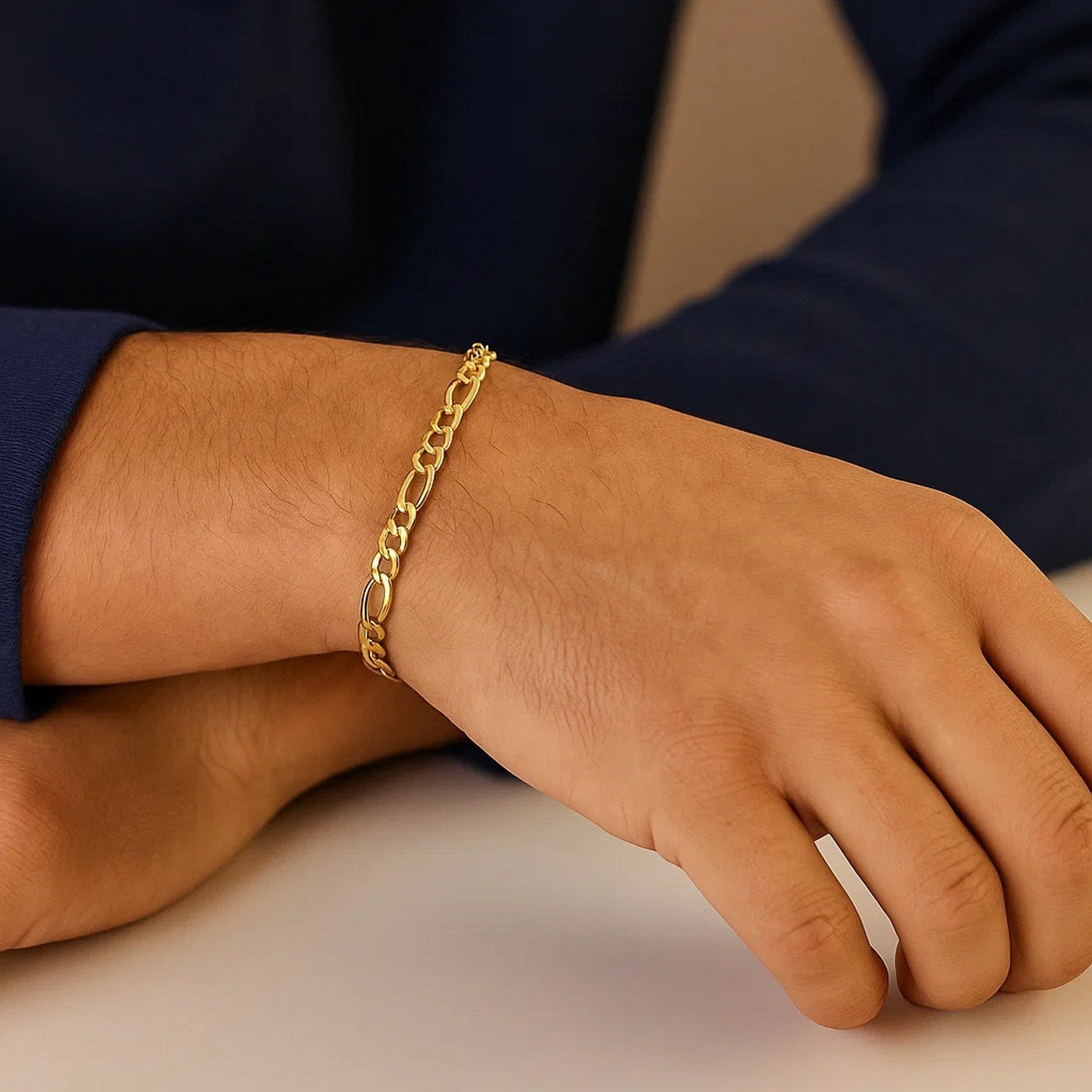14k yellow gold solid Figaro bracelet with modern chain links, showcasing elegance and luxury in every detail.