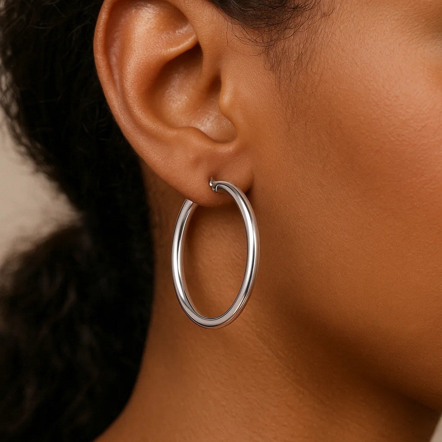 Polished 14k white gold hoop earrings, modern design, 4x40mm, perfect for elegant everyday wear.