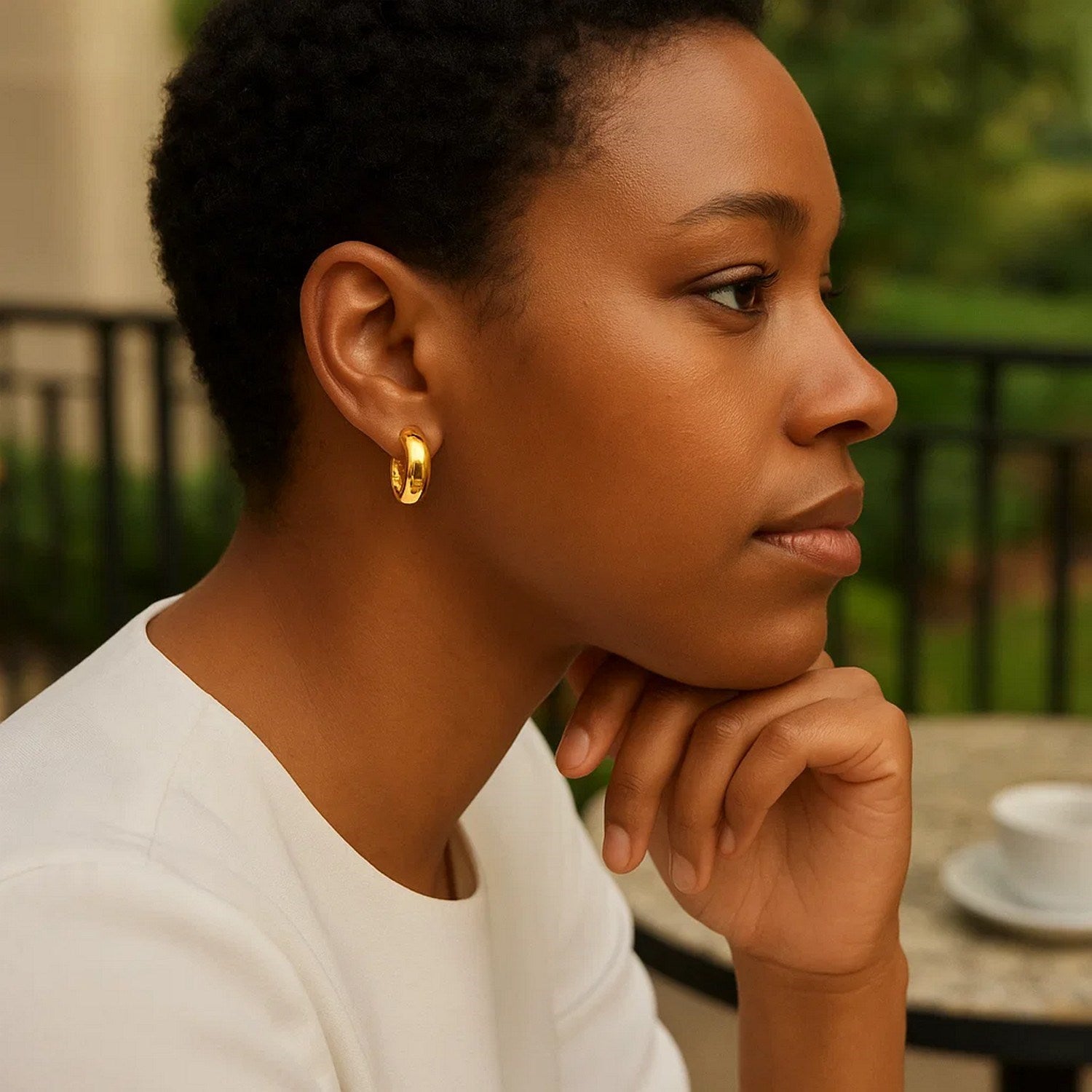 14k yellow gold polished wide small hoop earrings, embodying minimalist elegance and timeless sophistication.
