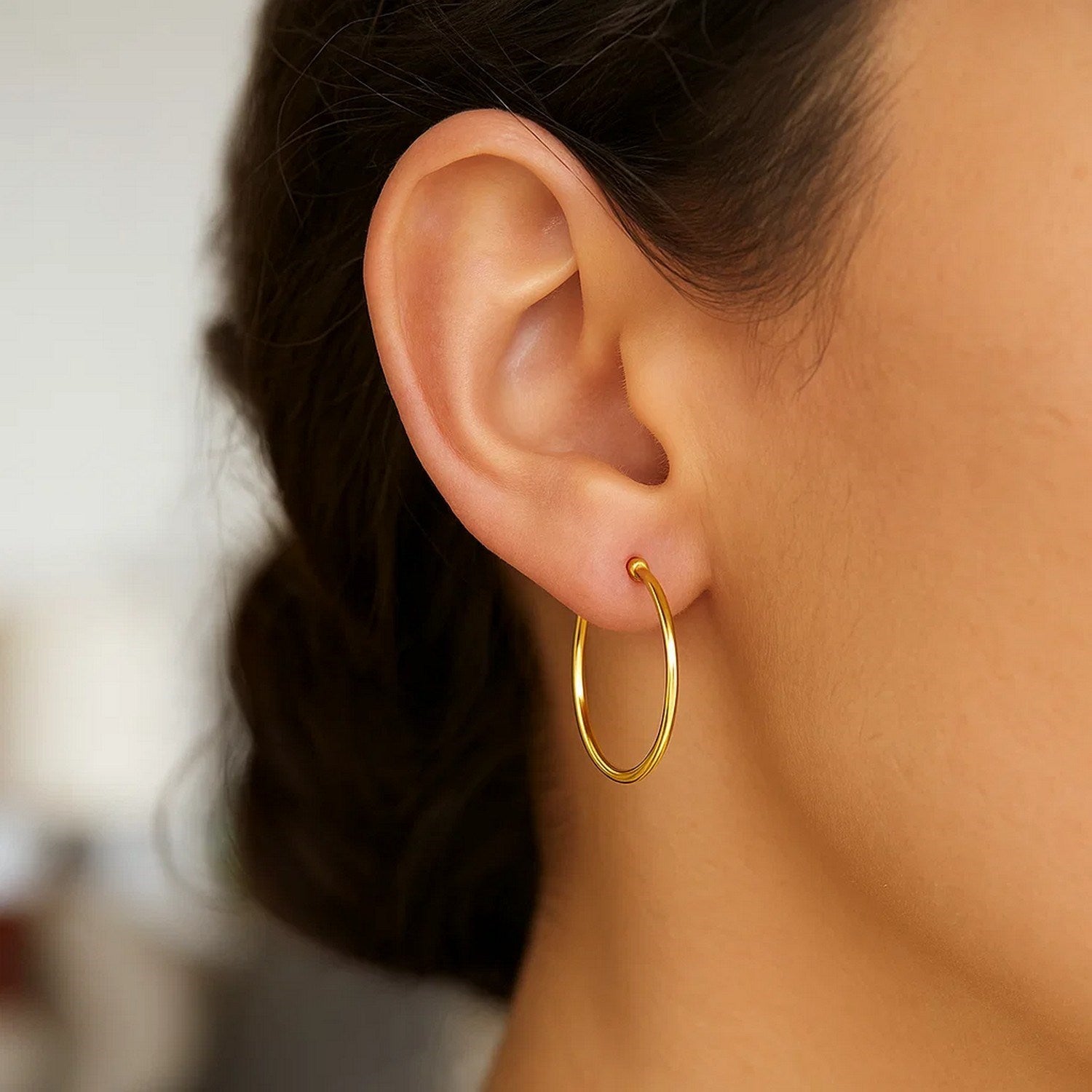 14k yellow gold polished hoop earrings, minimalist design, elegant 1.5x25mm size for timeless luxury style.