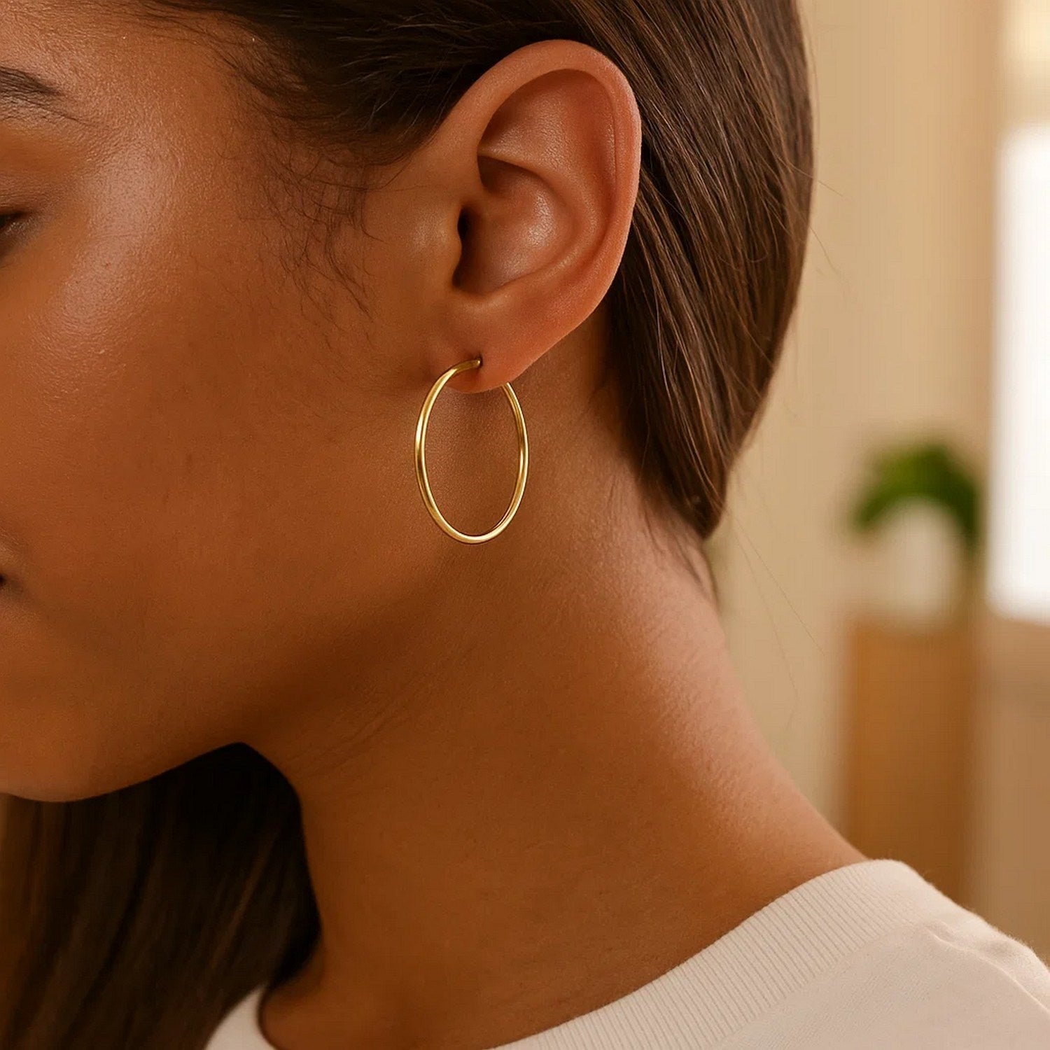14k yellow gold polished hoop earrings, minimalist design, elegant shine, perfect for any sophisticated occasion.