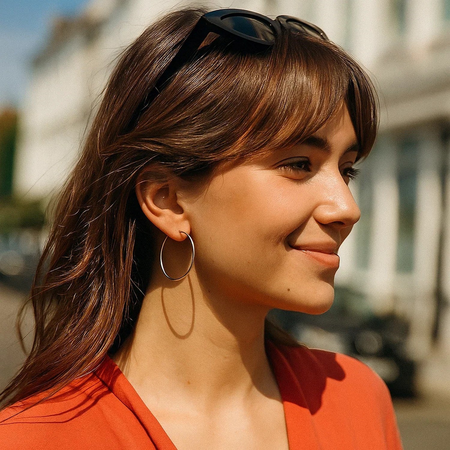 Polished 14k white gold hoop earrings with a modern design, showcasing elegance and timeless sophistication.