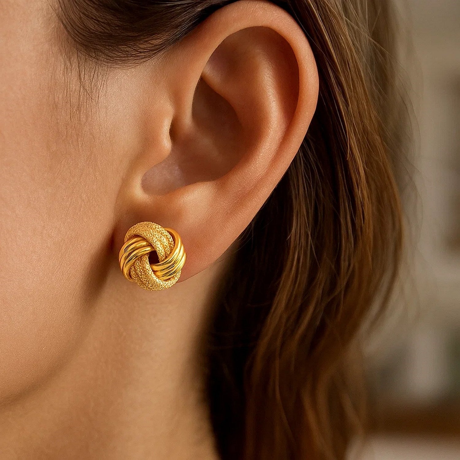 Elegant 14k yellow gold textured polished stud earrings, showcasing a refined design for sophisticated style.