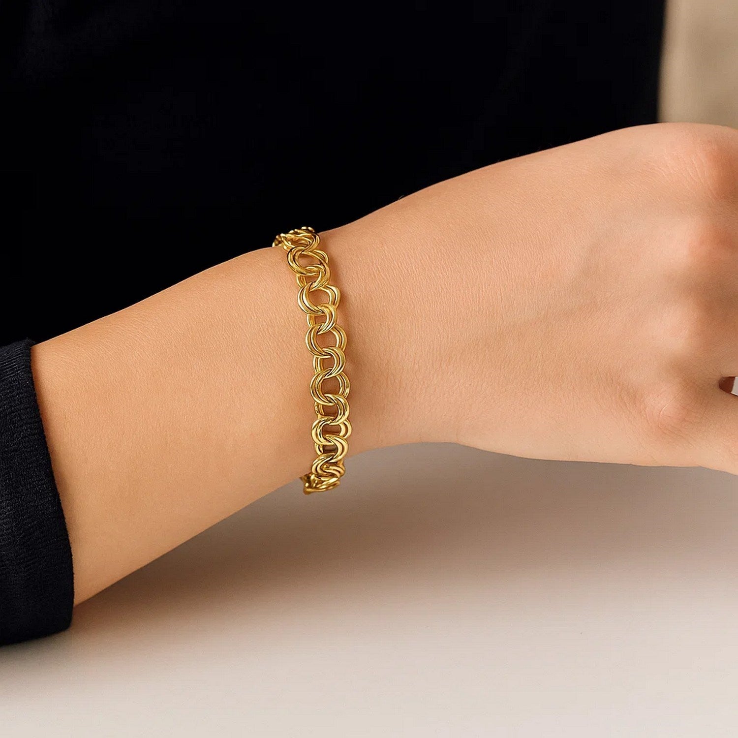 14k yellow gold charm bracelet with modern design, featuring 4.00 mm links for a luxurious touch.