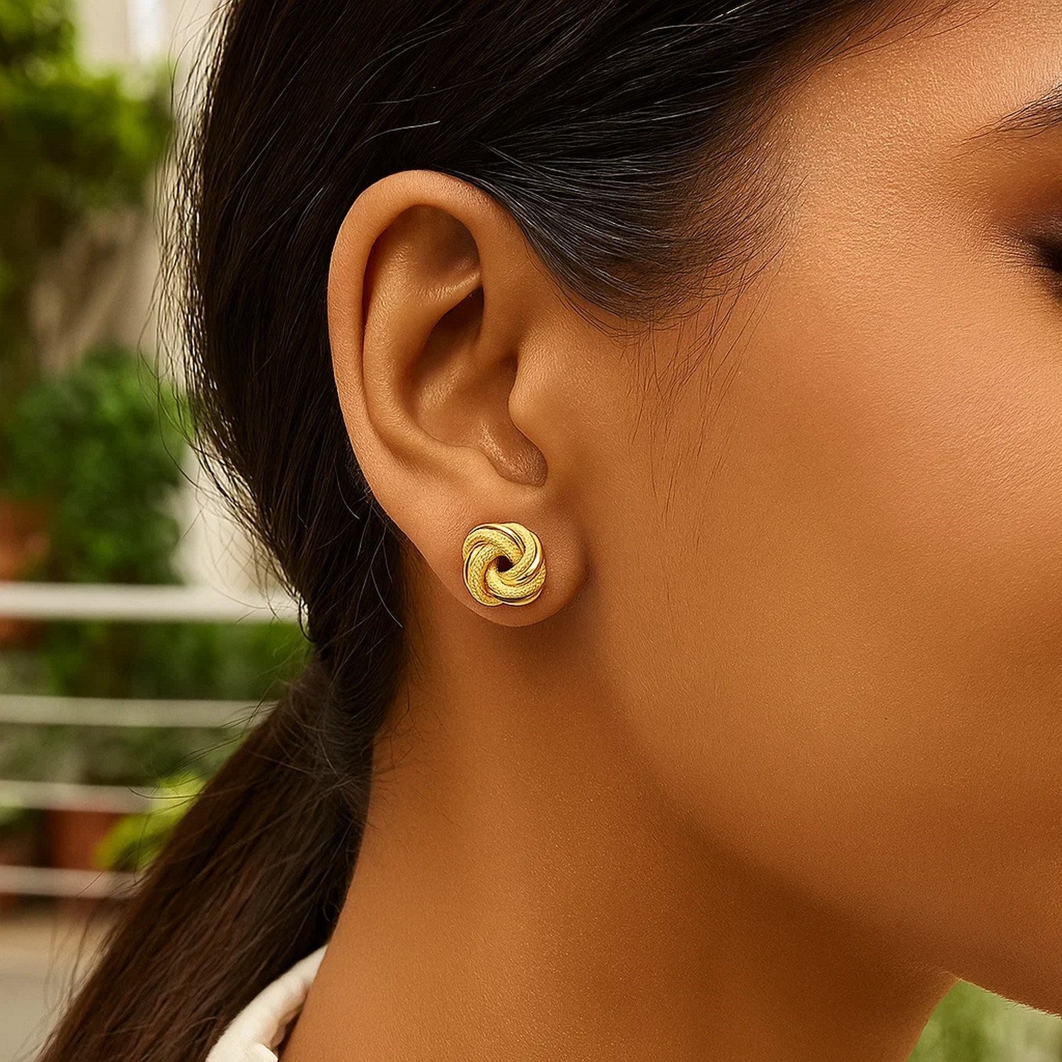 Elegant 14k yellow gold textured polished stud earrings, showcasing a refined design perfect for any occasion.