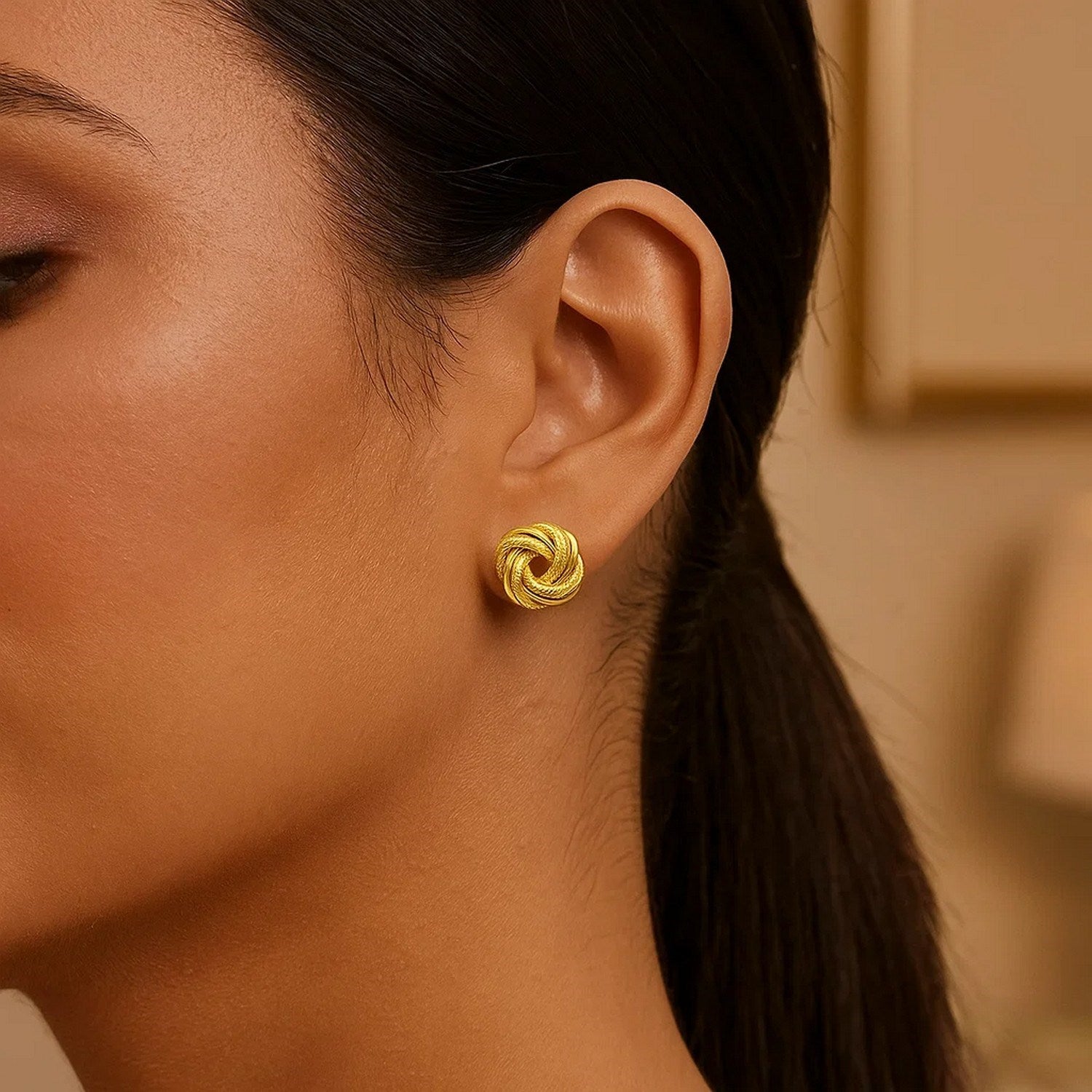 14k yellow gold textured polished stud earrings exuding elegance and sophistication for any occasion.