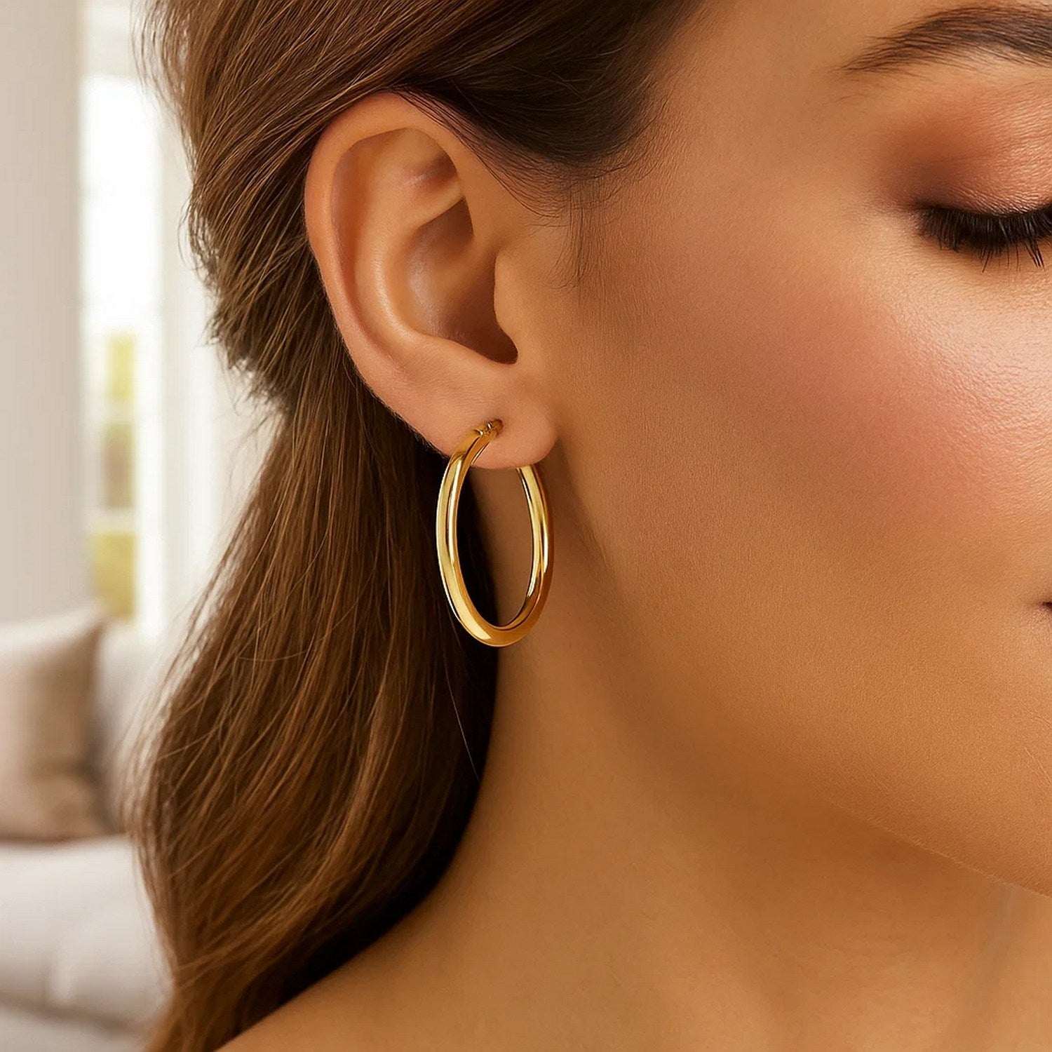 14k yellow gold polished hoop earrings, modern design, 4x40mm, perfect for elegant everyday wear.