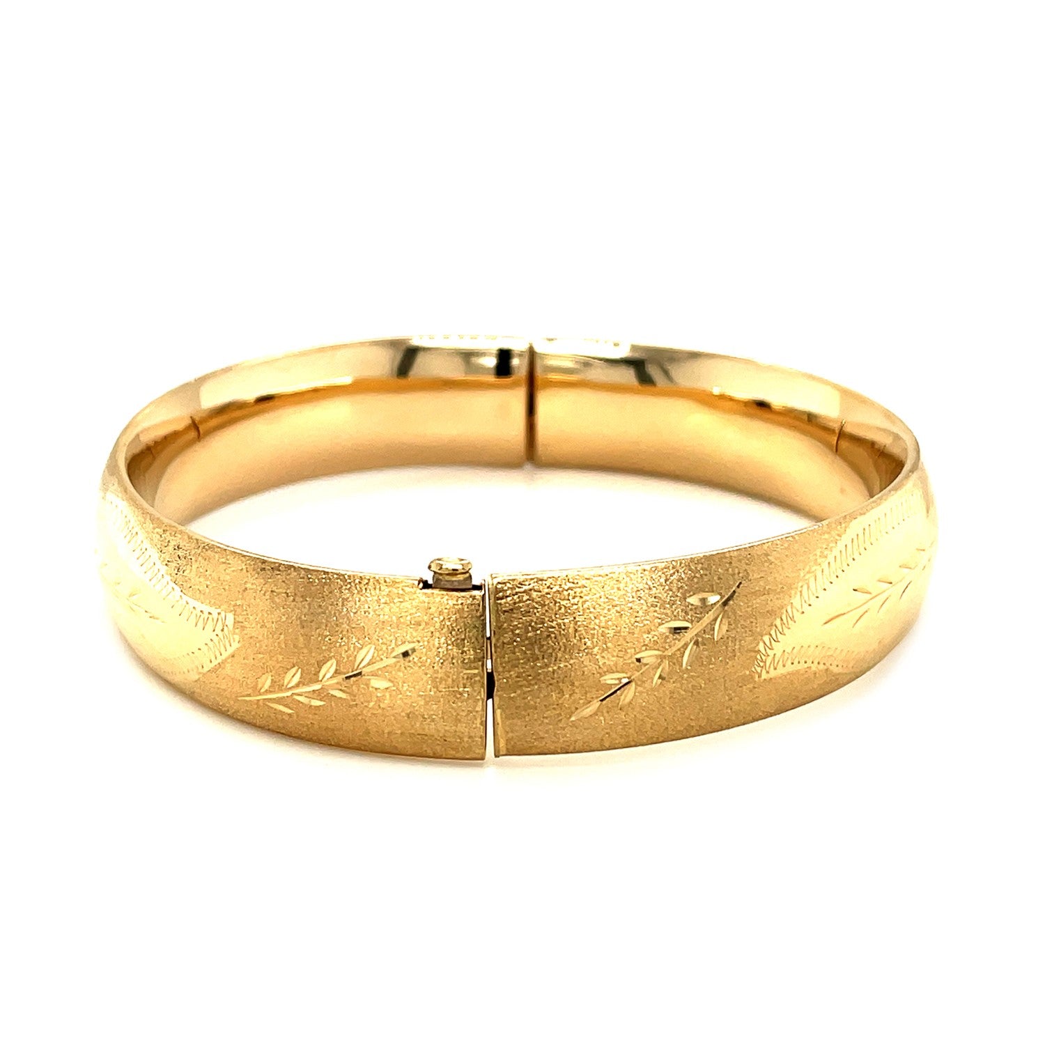 Classic floral carved bangle in 14k yellow gold, showcasing modern elegance with a refined stud design.