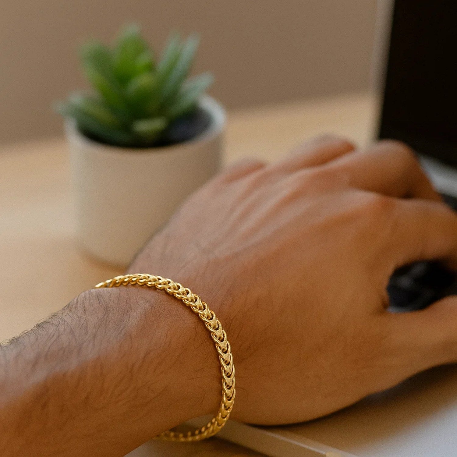 14k yellow gold square Franco bracelet featuring classic stud links, elegantly crafted for timeless luxury.