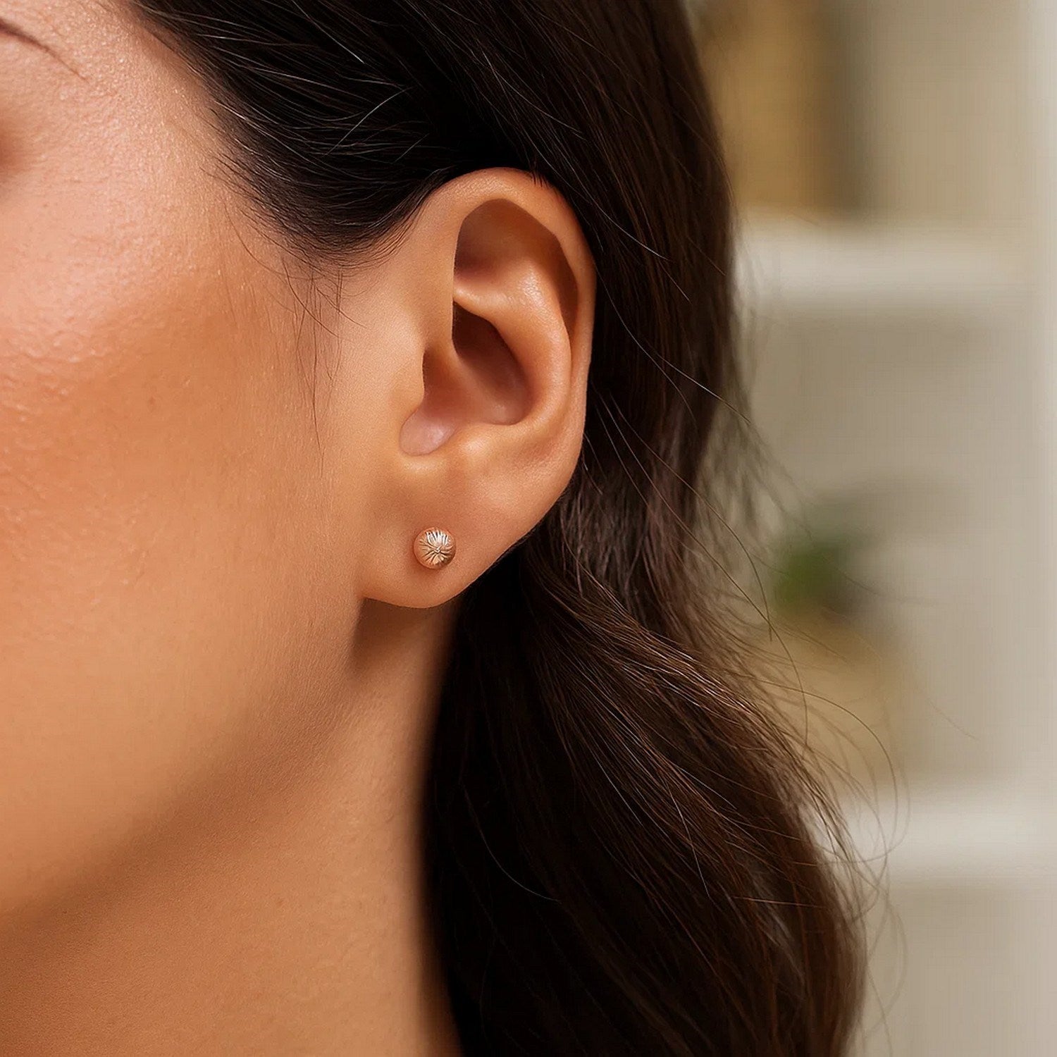 14k rose gold textured ball stud earrings showcasing modern elegance and luxurious craftsmanship.