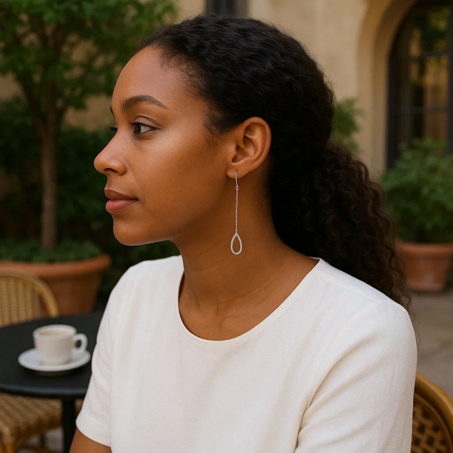Elegant 14k white gold textured drop earrings featuring a graceful chain design, perfect for sophisticated occasions.