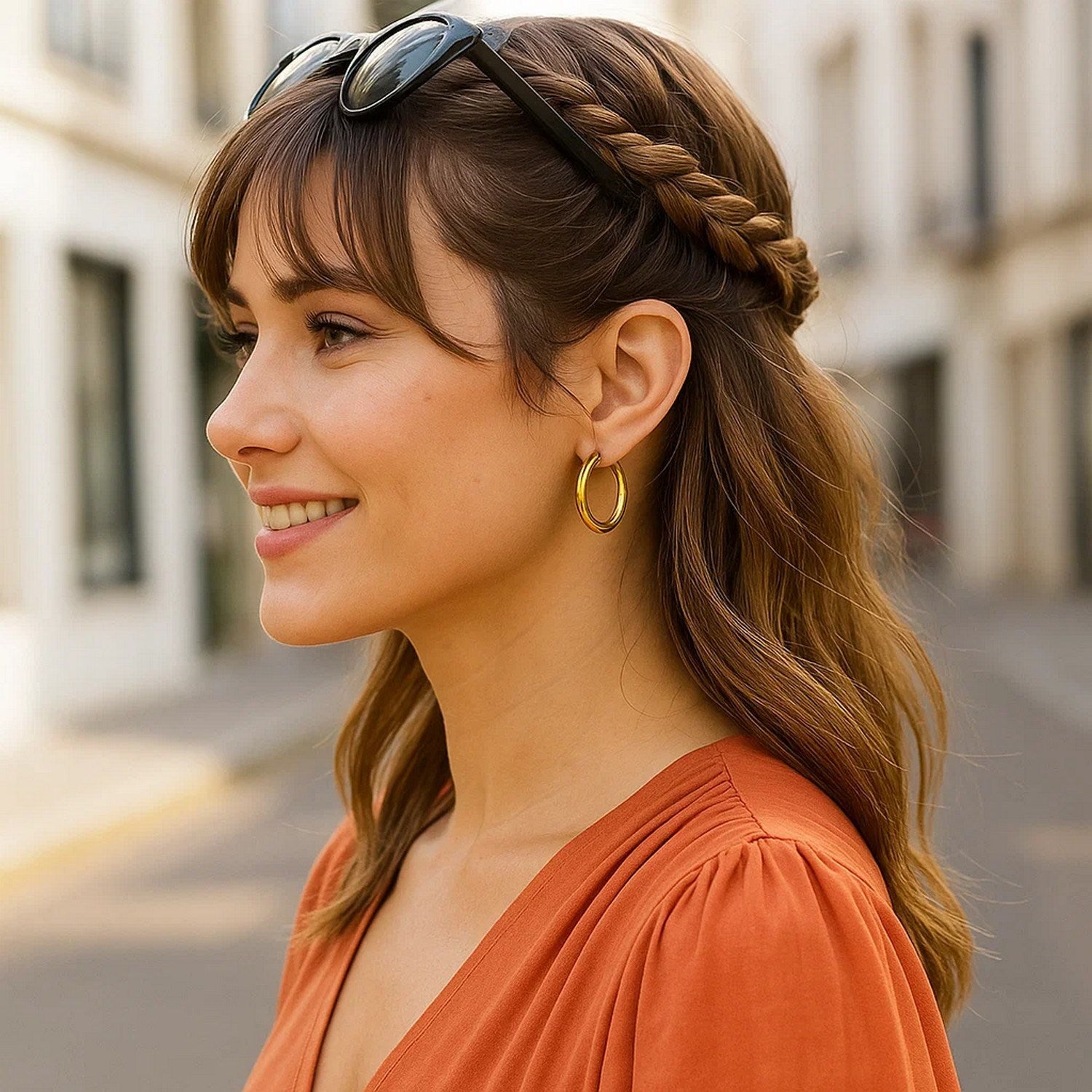 14k yellow gold polished hoop earrings, modern design, elegant shine, perfect for any luxury jewelry collection.