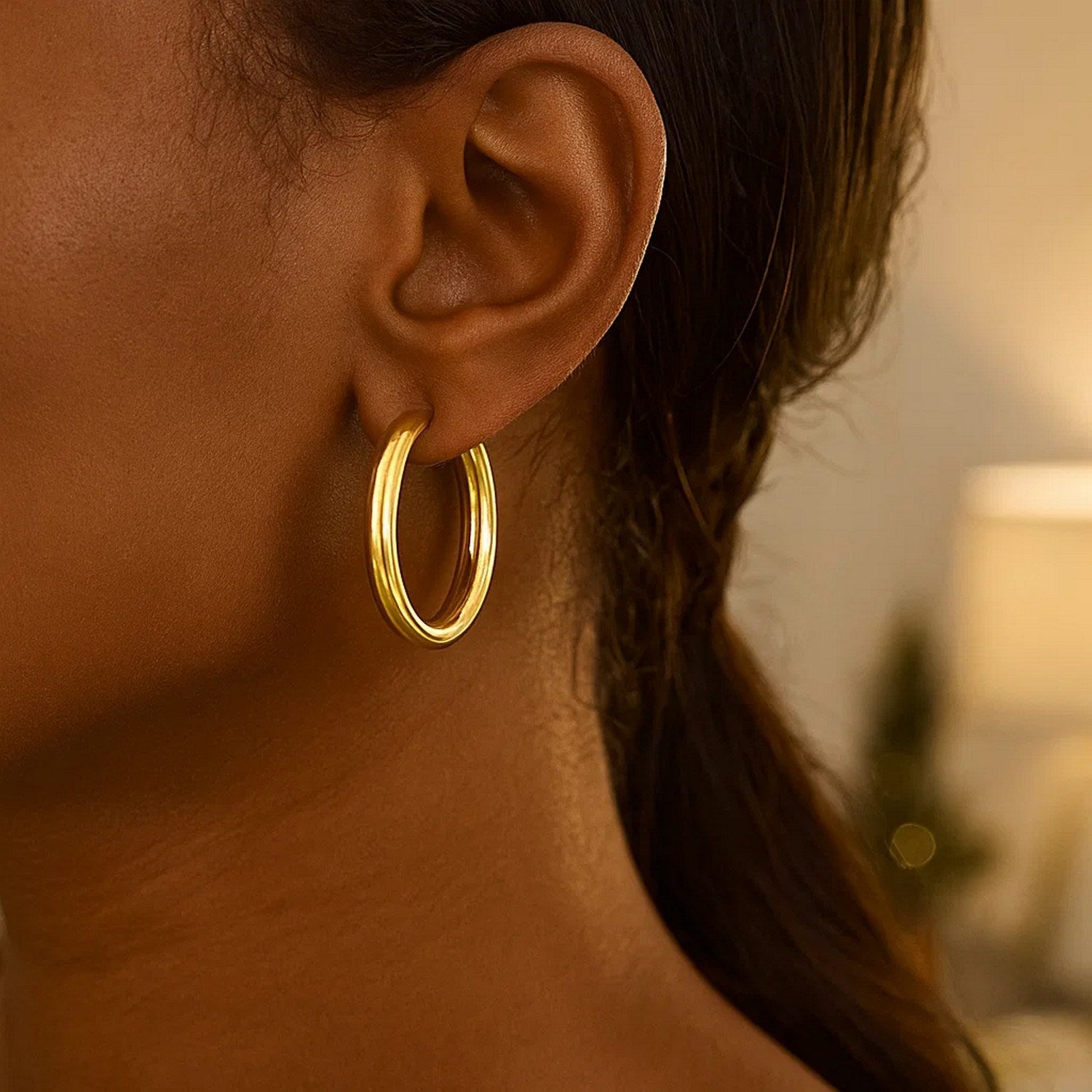 14k yellow gold polished hoop earrings with a sleek modern design, perfect for elegant everyday wear.