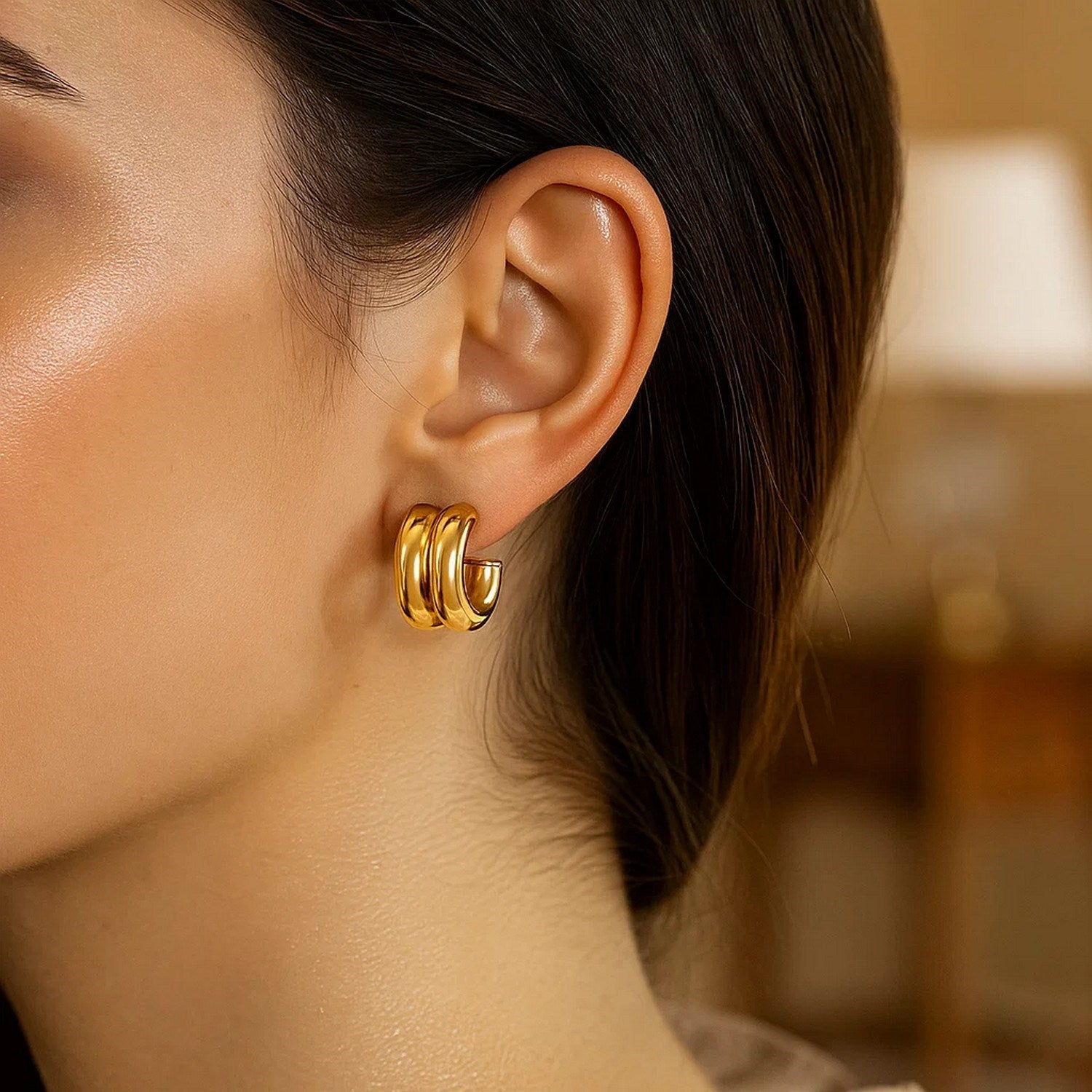 14K yellow gold puffed double row C hoop earrings with a modern design, showcasing elegant round shapes.
