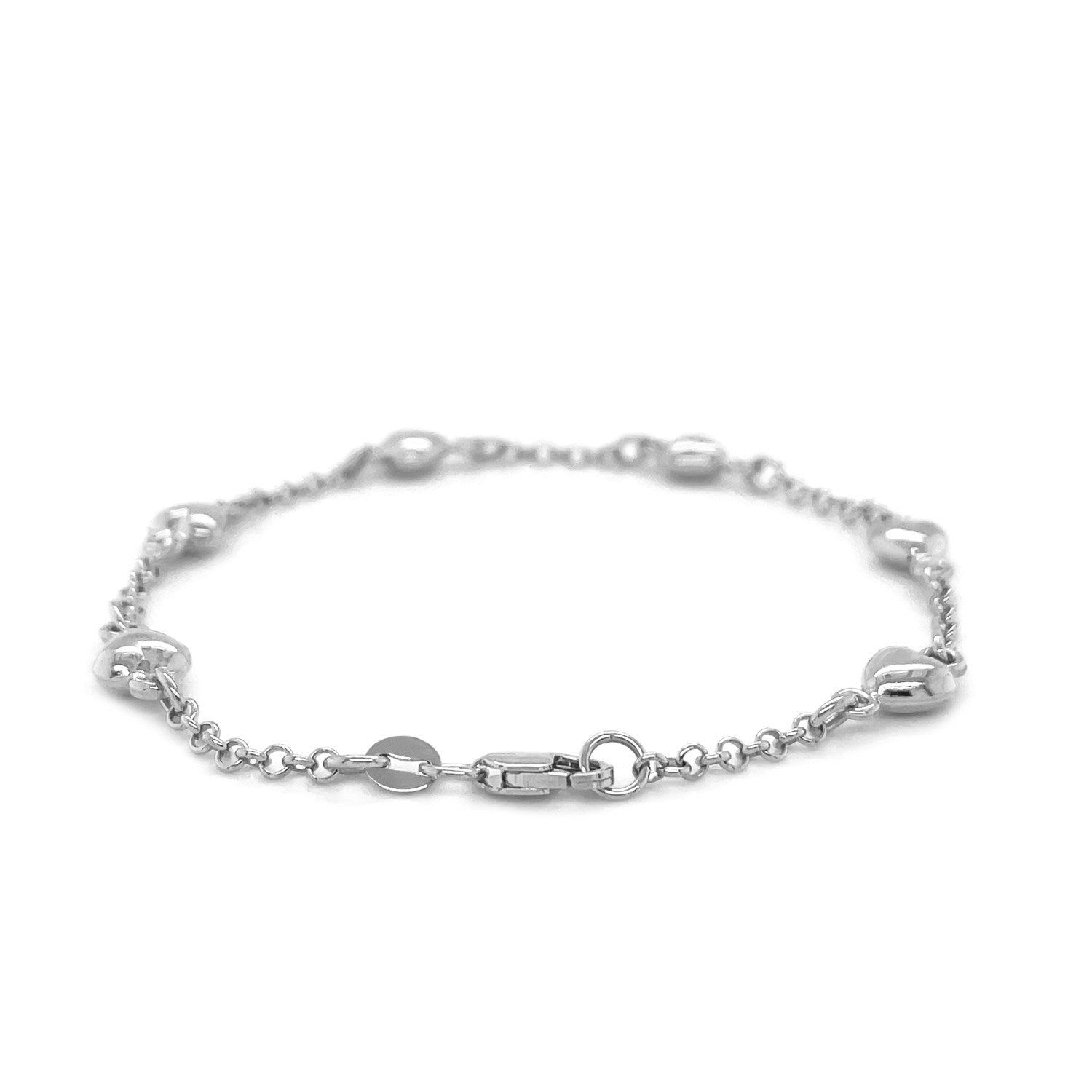 14k white gold rolo chain bracelet featuring elegant puffed heart stations in a classic design.