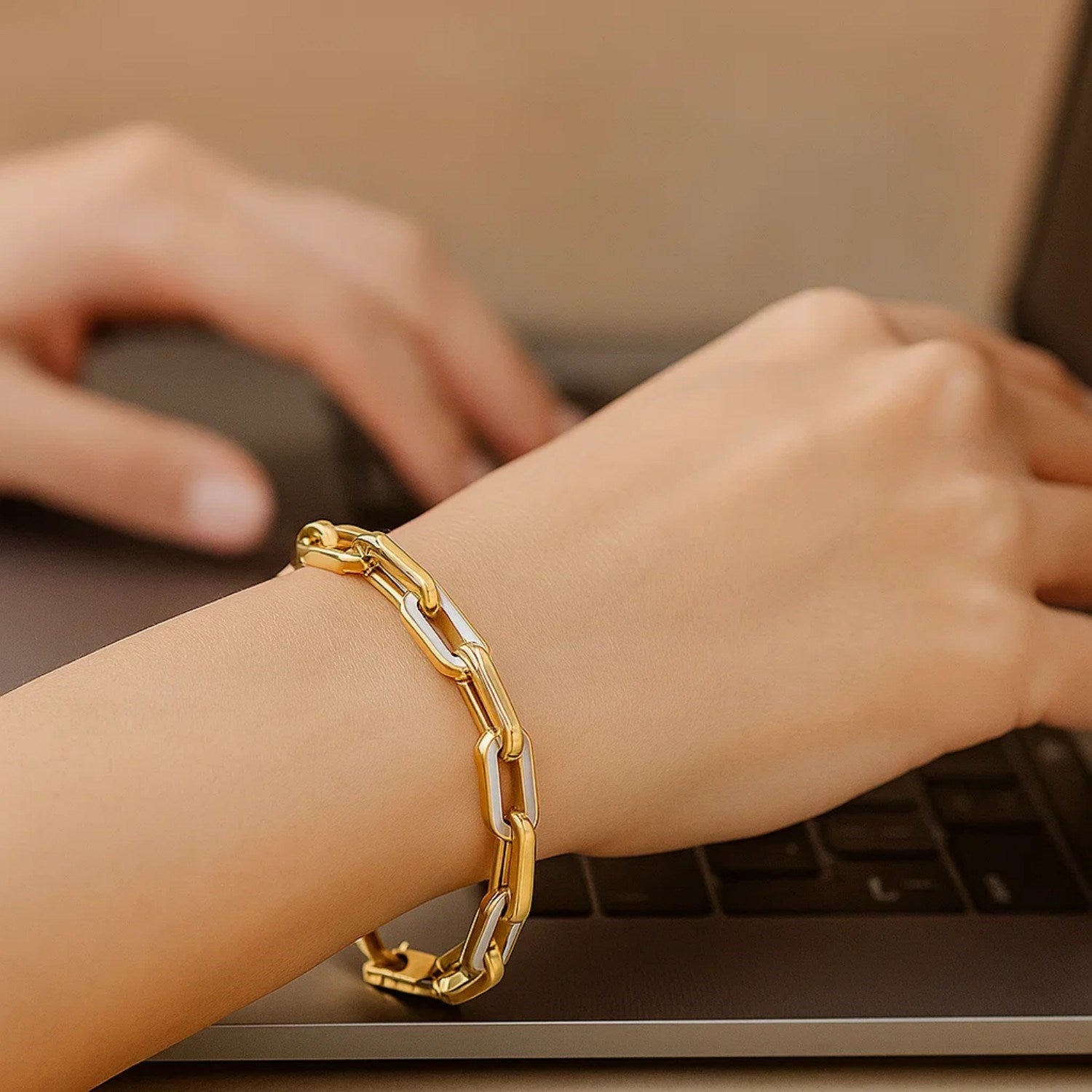 14k yellow gold modern paperclip bracelet featuring lustrous MOP gem links for a chic, sophisticated look.