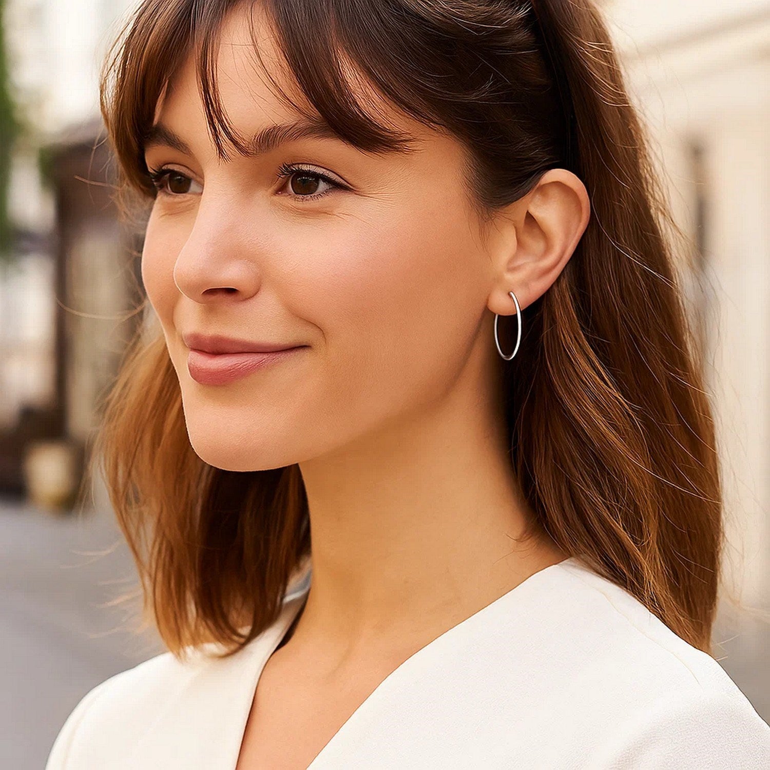 Polished 14k white gold hoop earrings showcasing a modern design, perfect for elegant everyday wear.