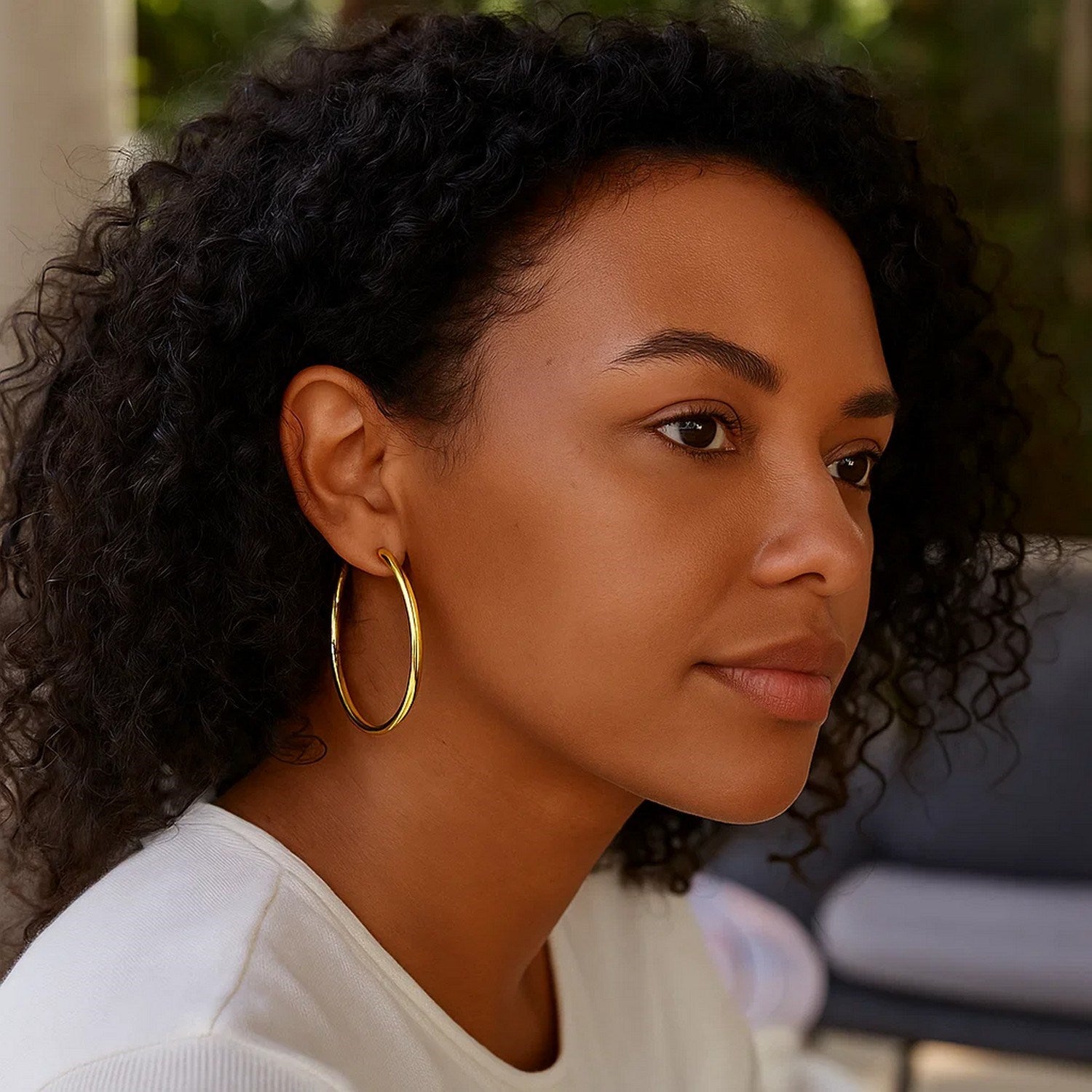 14k yellow gold polished hoop earrings, modern design, 3x50mm, perfect for elegant everyday wear.