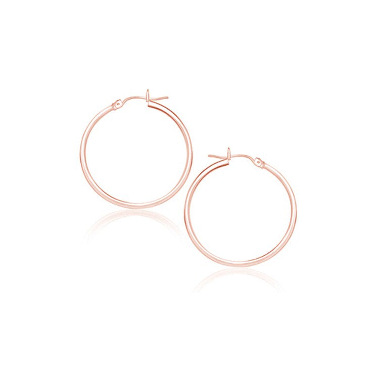 14k rose gold polished hoop earrings with a sleek modern design, perfect for elegant everyday wear.