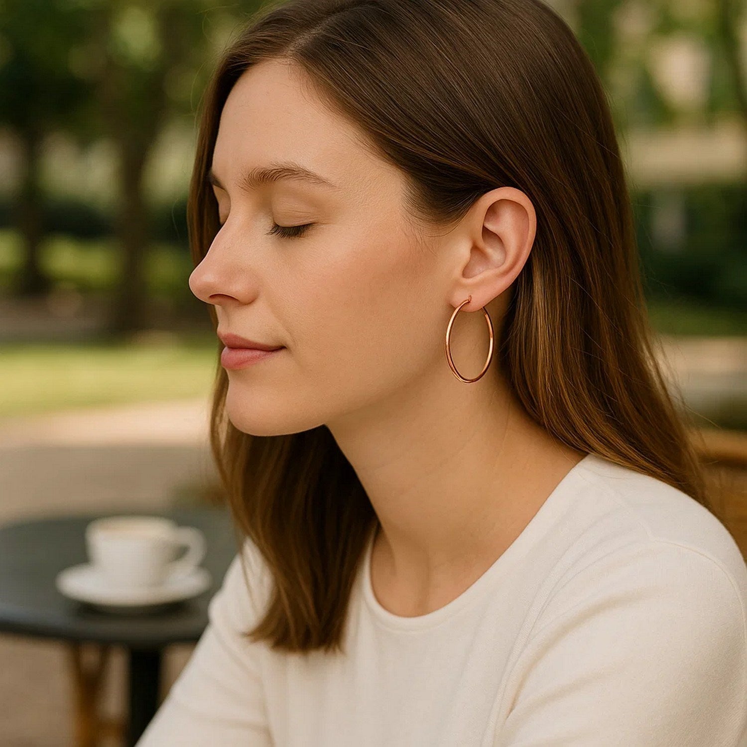 14k rose gold polished hoop earrings with a sleek modern design, perfect for elegant everyday wear.