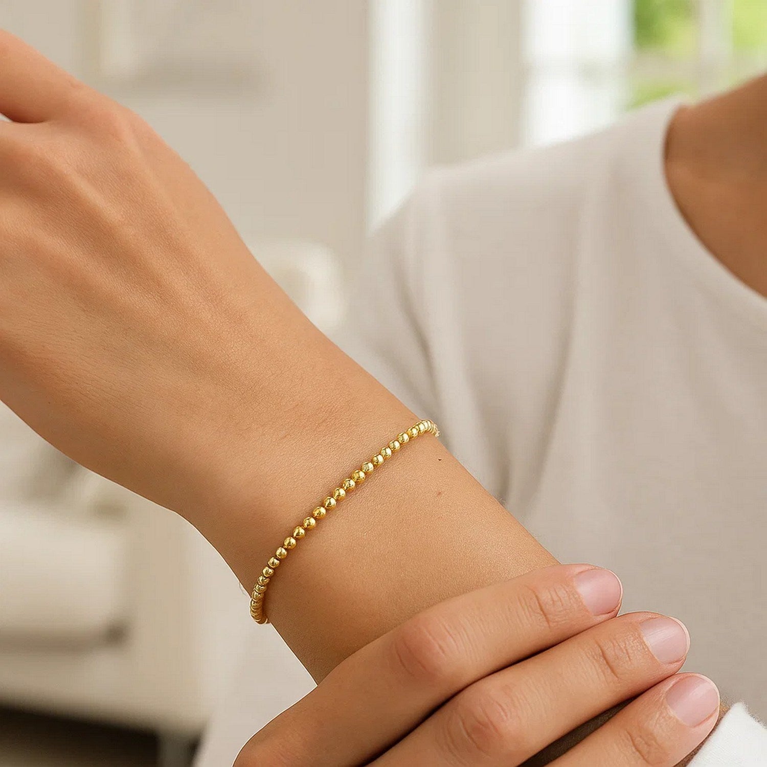 Elegant 14K yellow gold bead bracelet featuring refined 3.00 mm beads for a timeless luxury accessory.