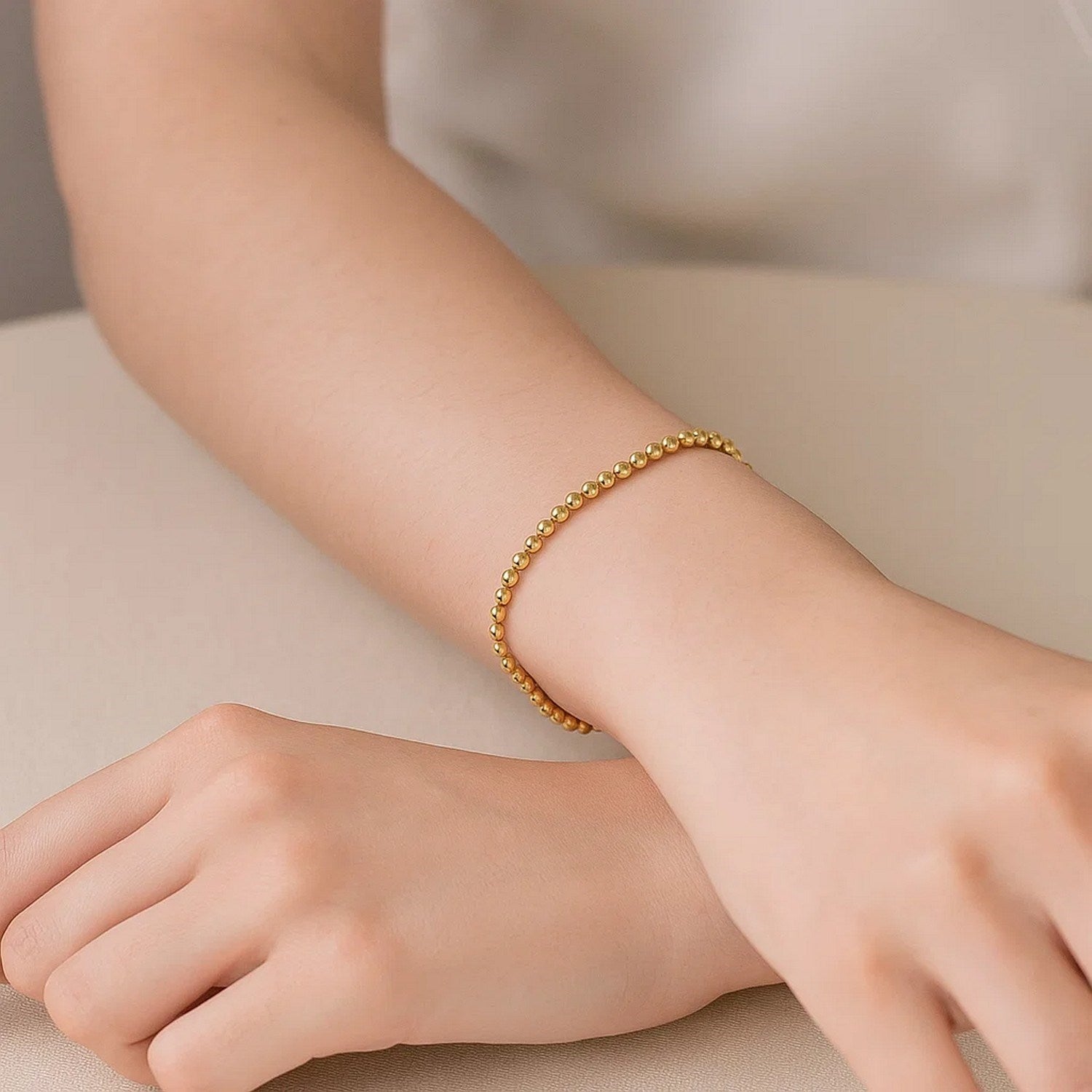 Elegant 14k yellow gold bead bracelet featuring a refined stud design, perfect for sophisticated layering or solo wear.