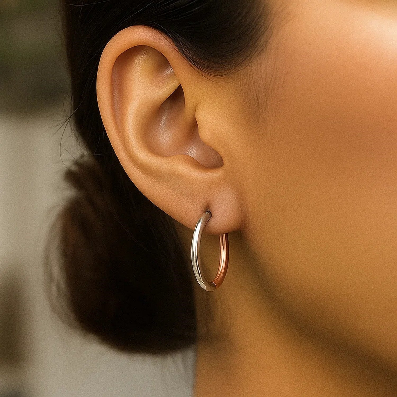 14k rose and white gold modern hinged hoop earrings, showcasing exquisite craftsmanship and elegant design.