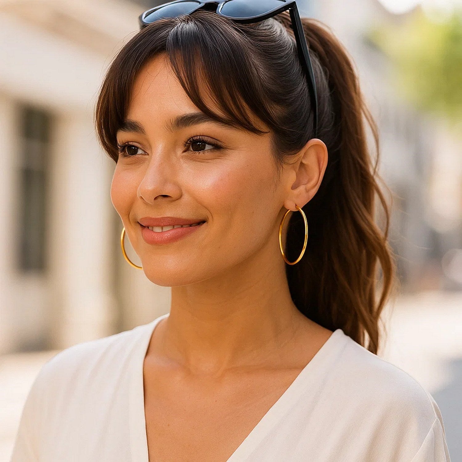 14k yellow gold polished hoop earrings, modern design, 45mm diameter, perfect for elegant everyday wear.