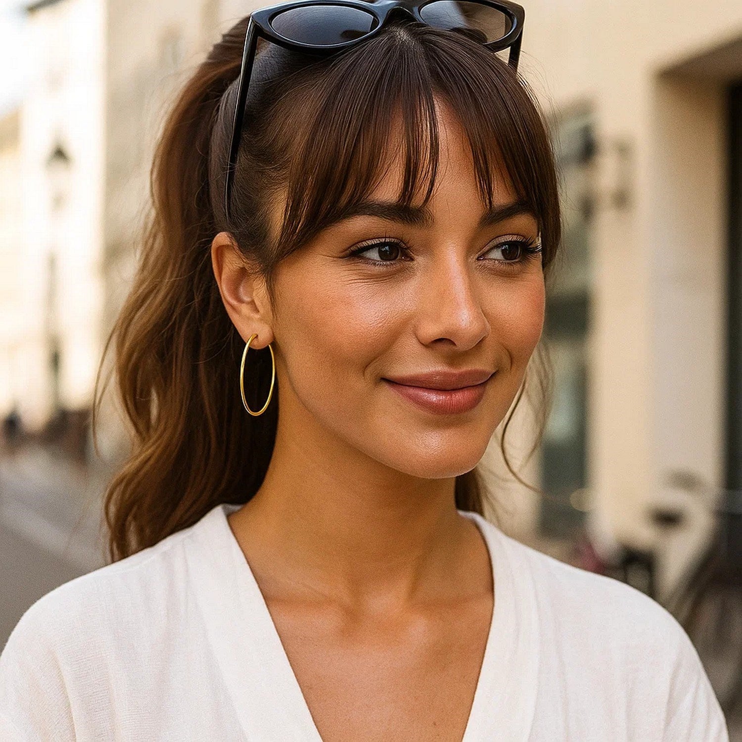 14k yellow gold polished hoop earrings, modern design, 45mm diameter, perfect for elegant everyday wear.