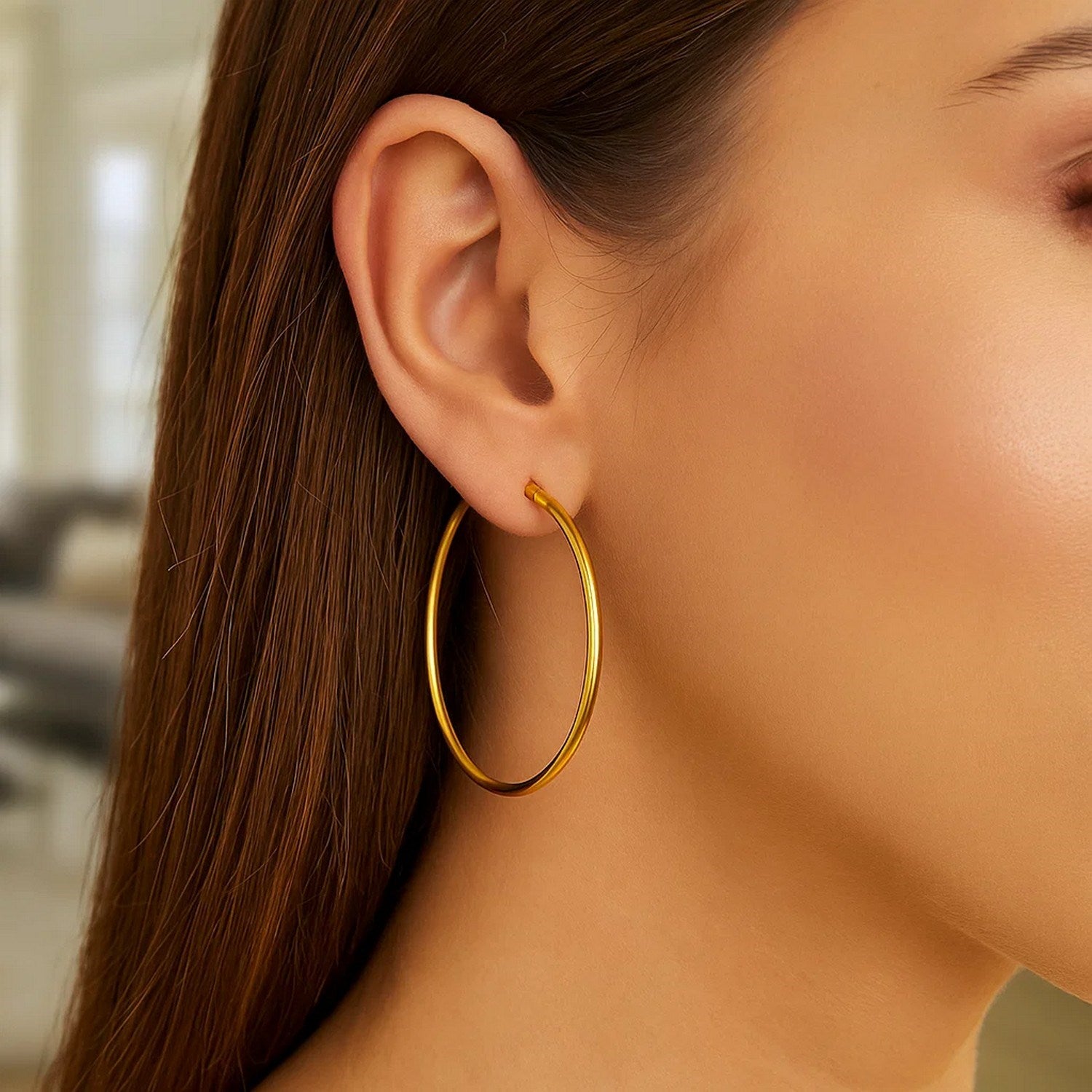 14k yellow gold polished hoop earrings, modern design, 45mm diameter, perfect for elegant everyday wear.