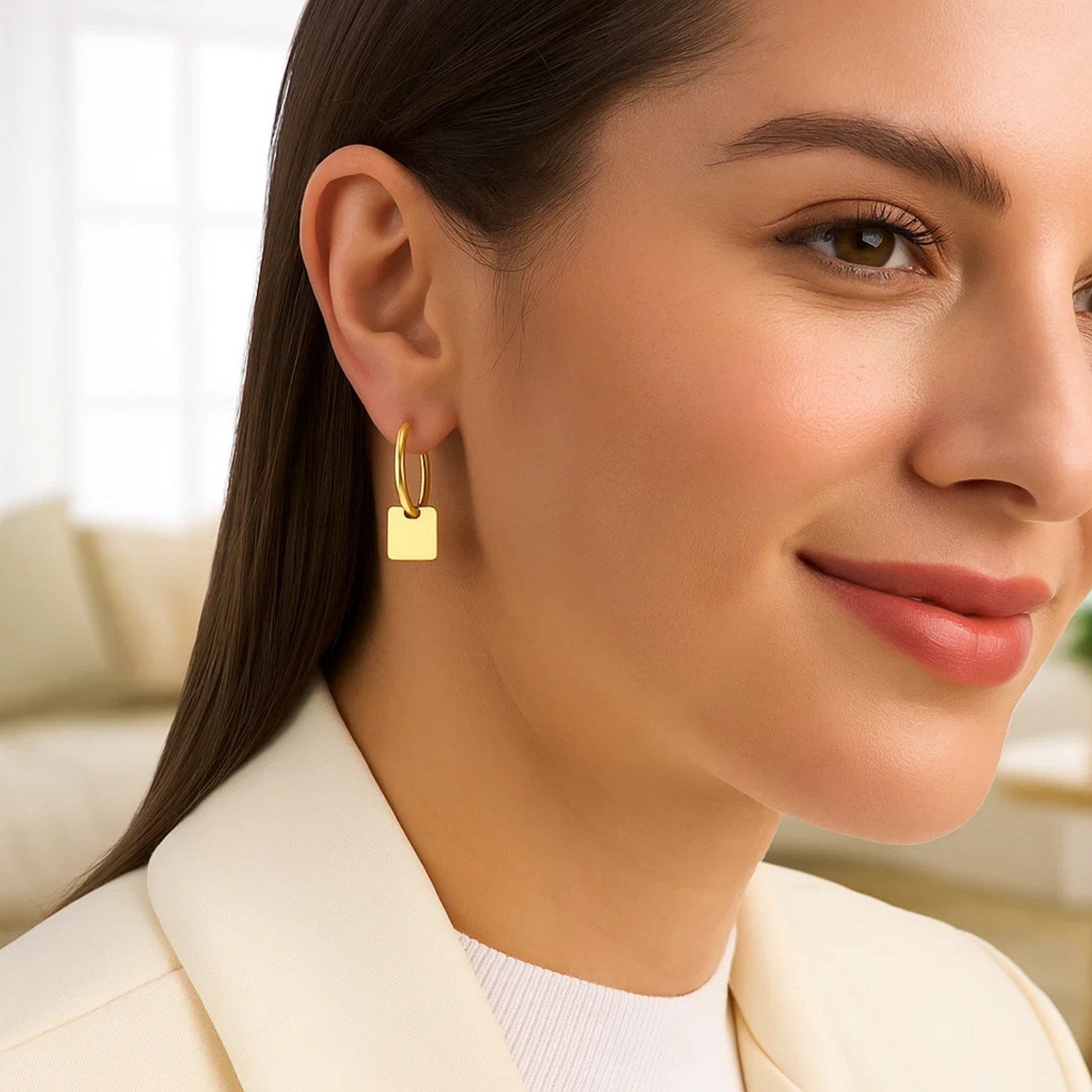 14k yellow gold polished huggie hoop earrings featuring elegant square drop accents for a modern touch.