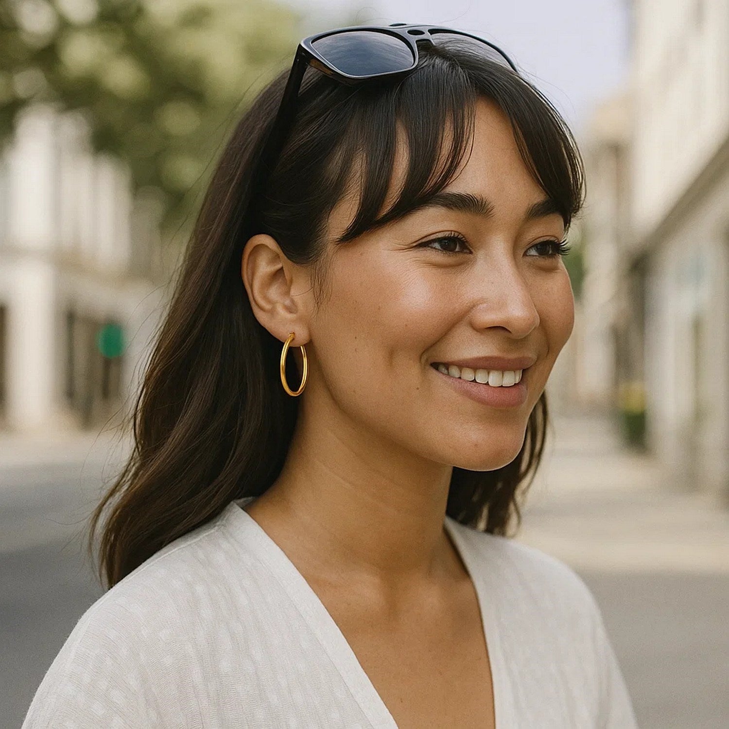 14k yellow gold polished hoop earrings, modern design, elegant shine, perfect for any luxury jewelry collection.