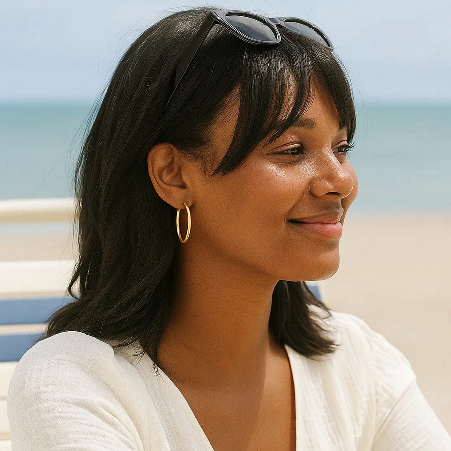 14k yellow gold polished hoop earrings, modern design, elegant shine, perfect for any luxury jewelry collection.