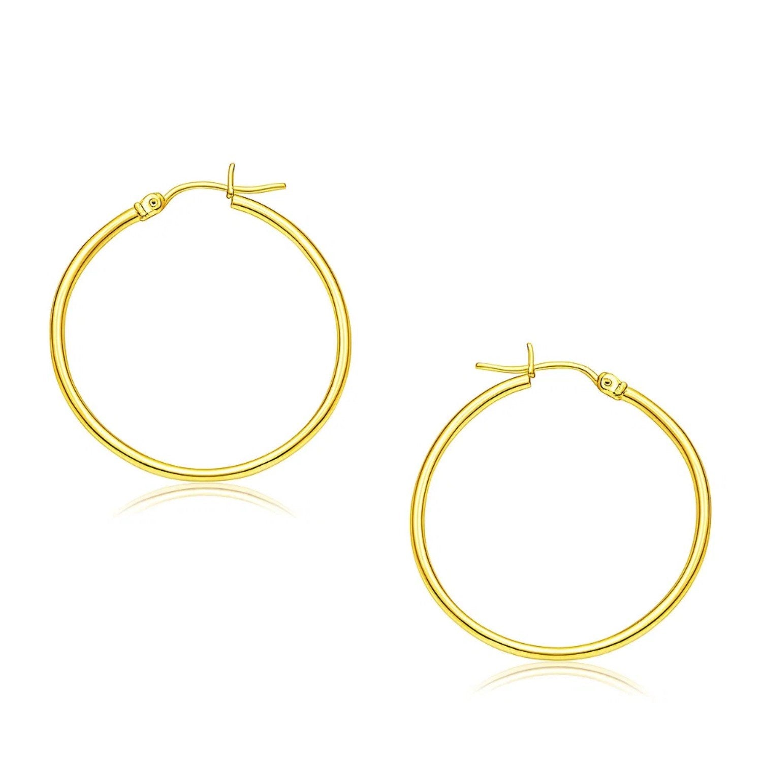 14k yellow gold polished hoop earrings, elegantly crafted, measuring 30mm for a timeless luxury statement.