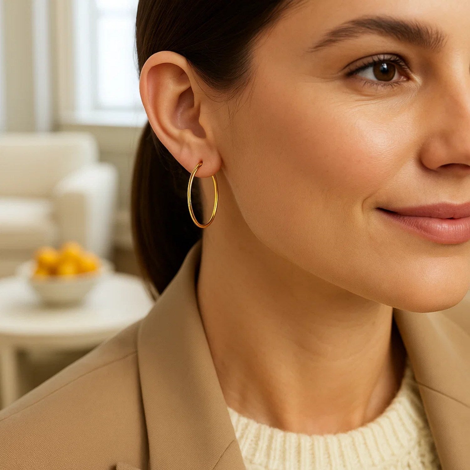 Elegant 14k yellow gold polished hoop earrings, measuring 30mm, showcasing timeless luxury and refined design.