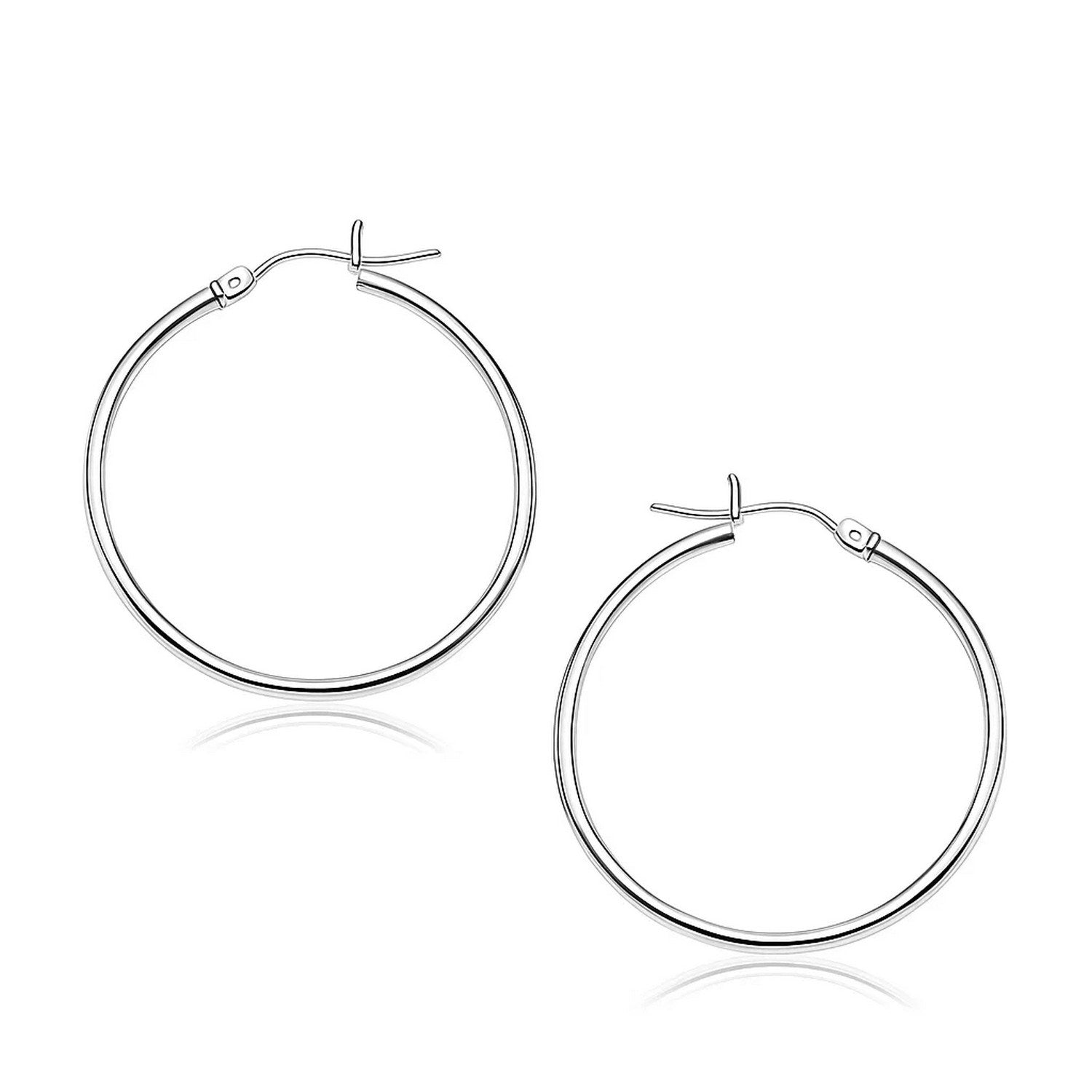 Elegant 14k white gold polished hoop earrings, showcasing a timeless design perfect for any luxury occasion.